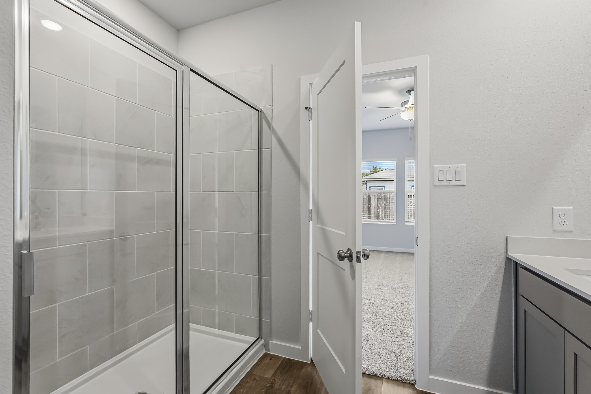 A bathroom with a glass shower.