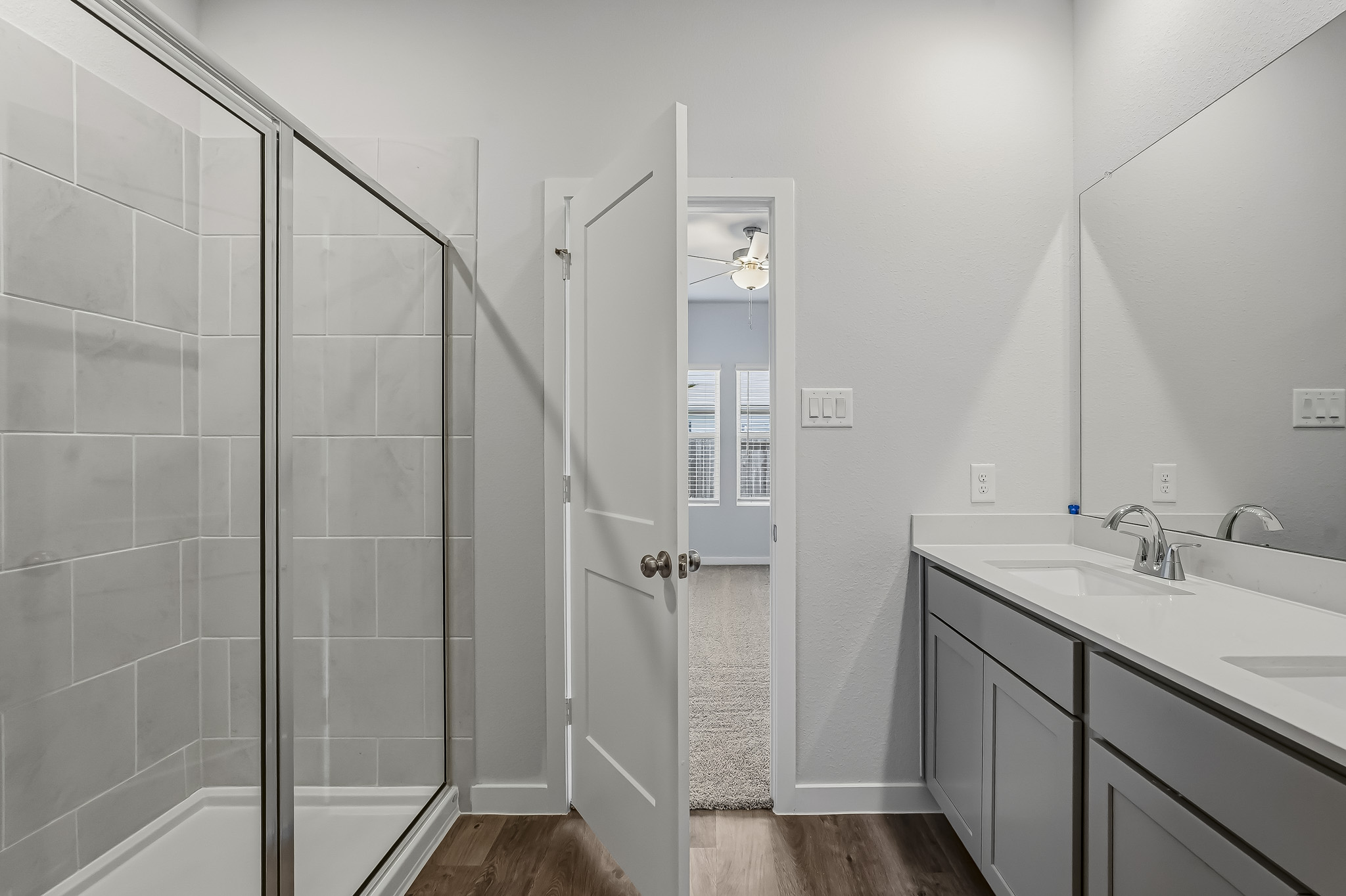 A bathroom with a glass shower.