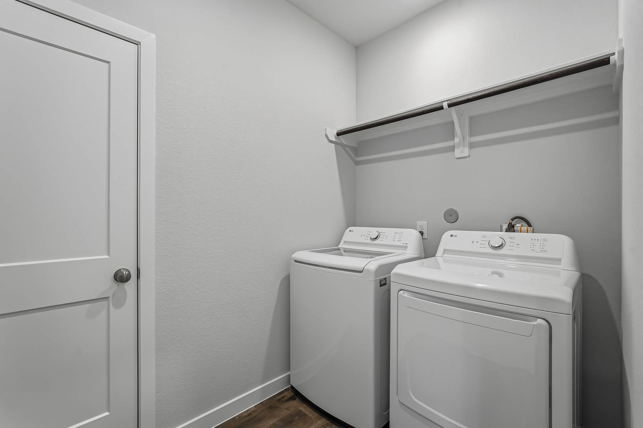 A washing machine in a room.