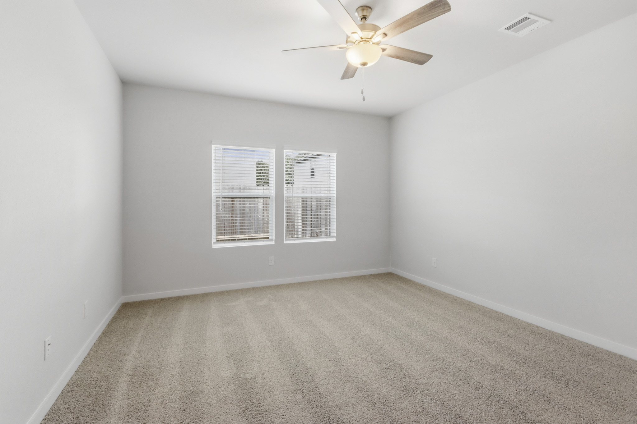A room with a ceiling fan and a ceiling fan.