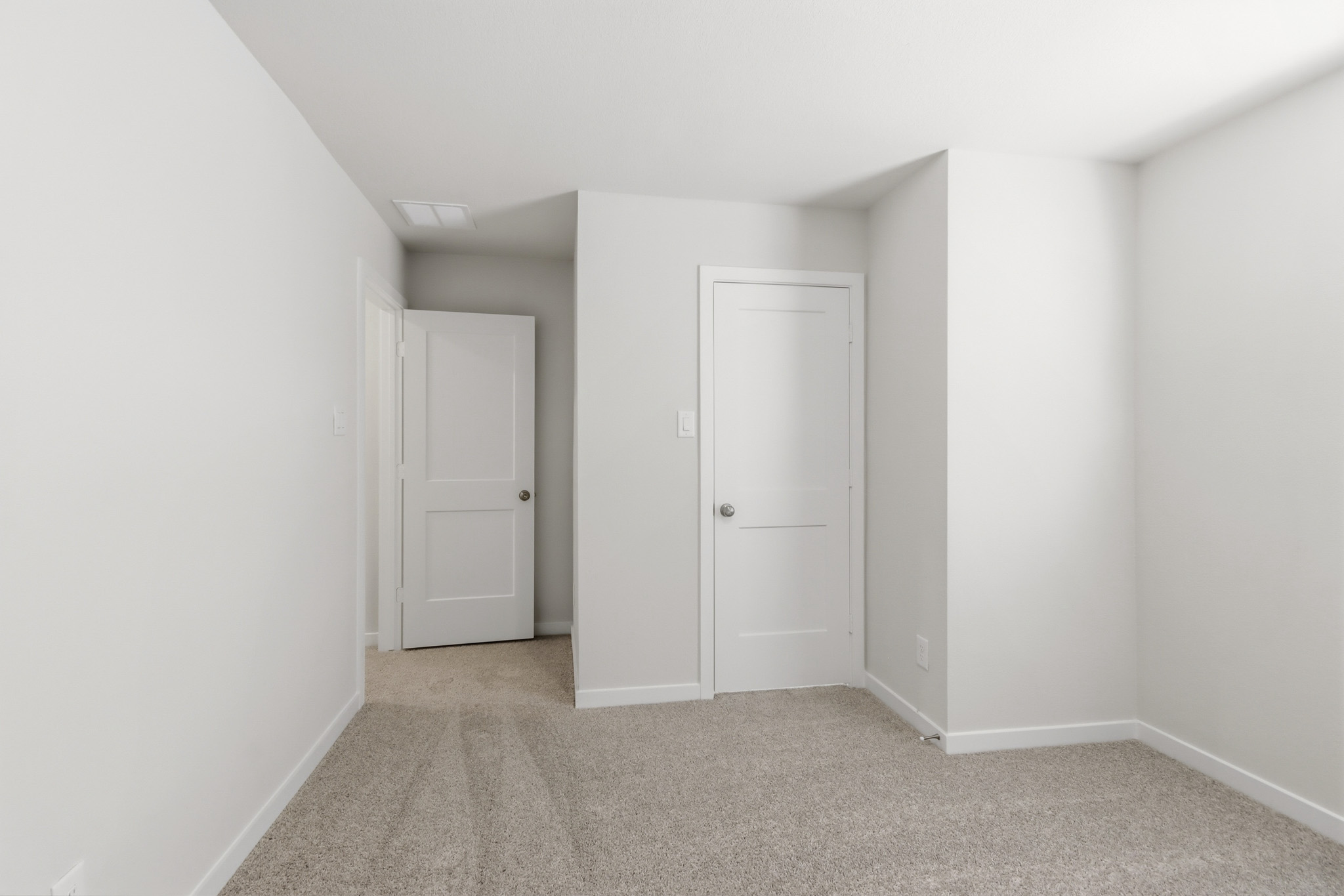 A room with white doors.