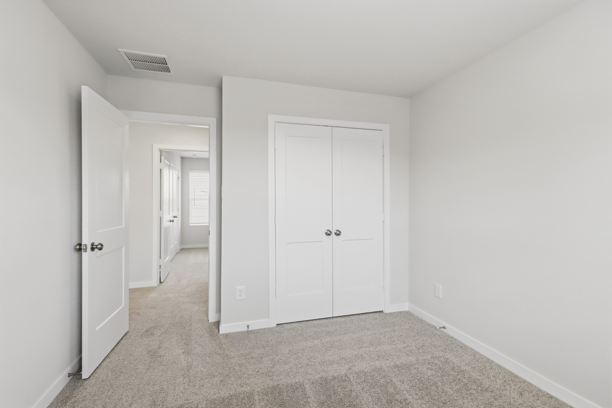 A room with white doors.