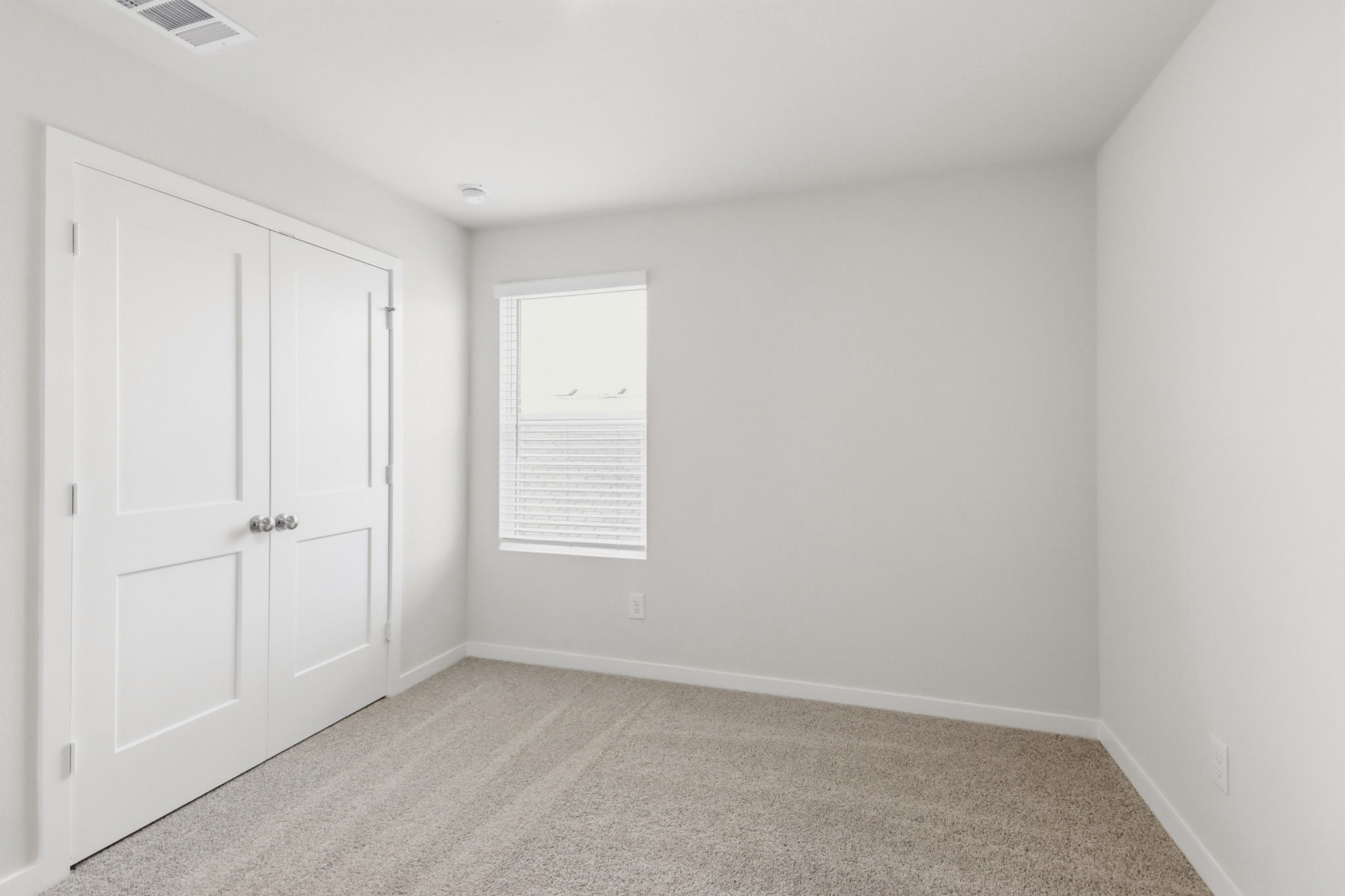 A room with white doors.