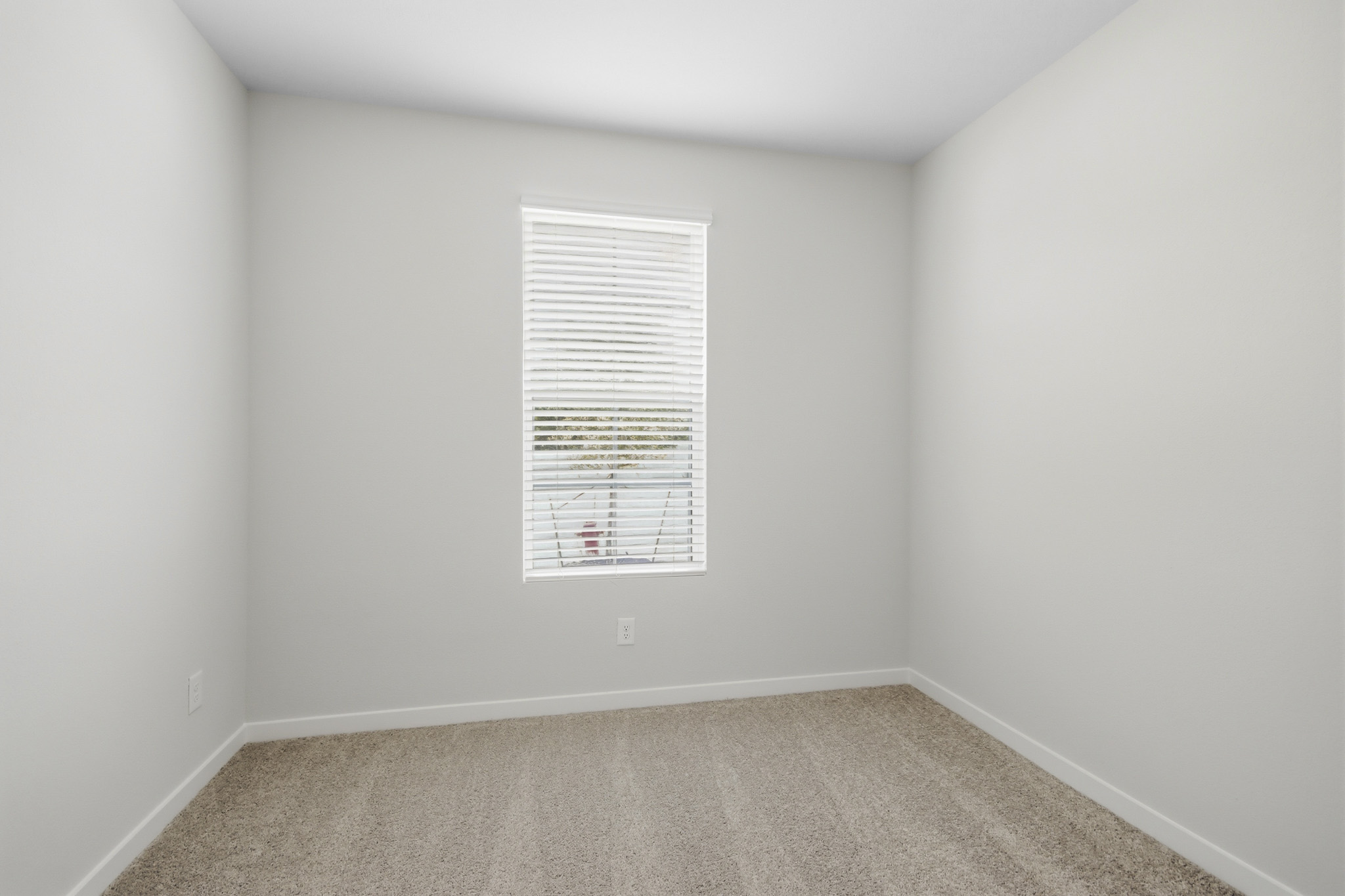 A room with a door and a window.