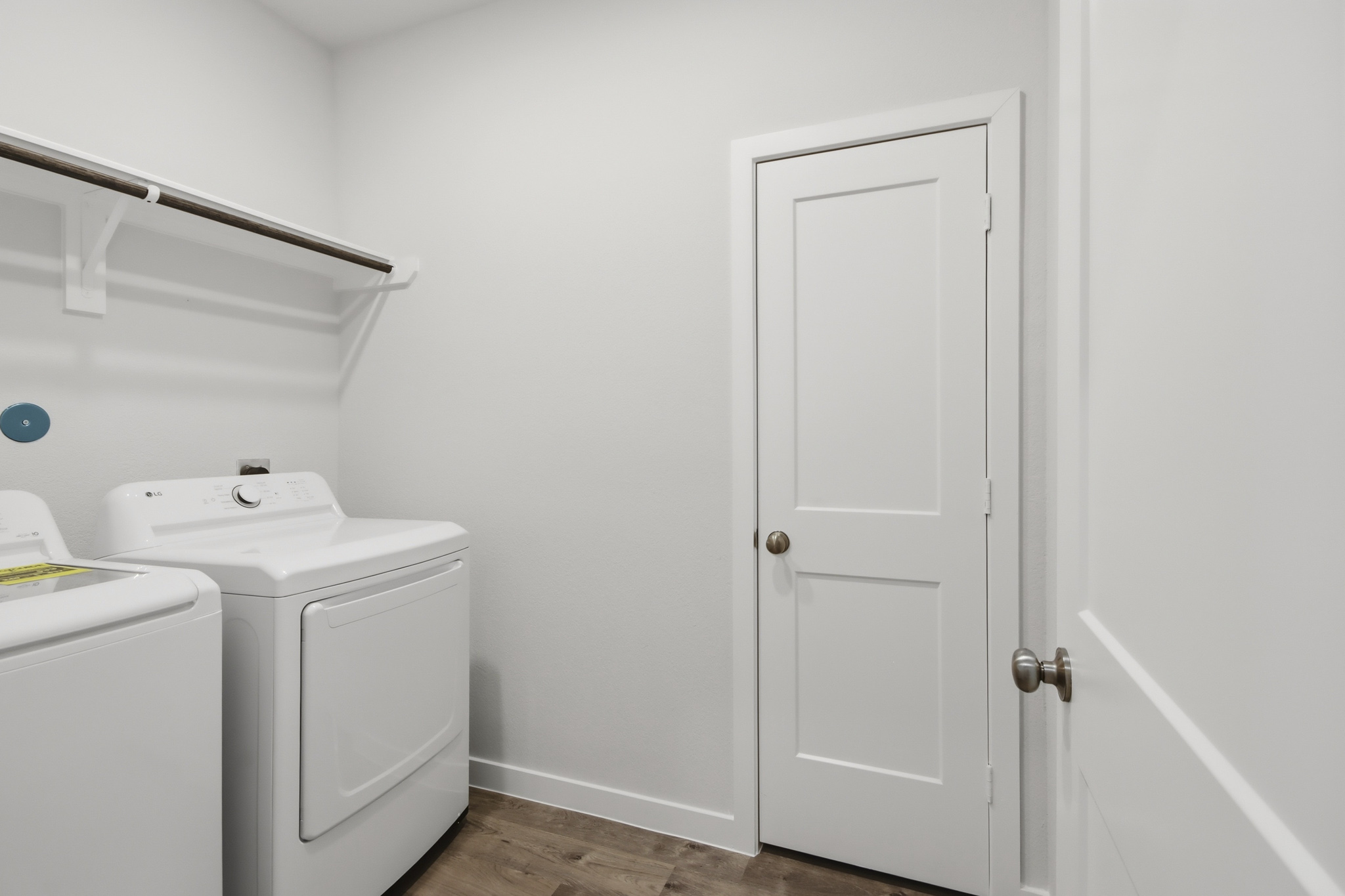 A white door next to a white door.