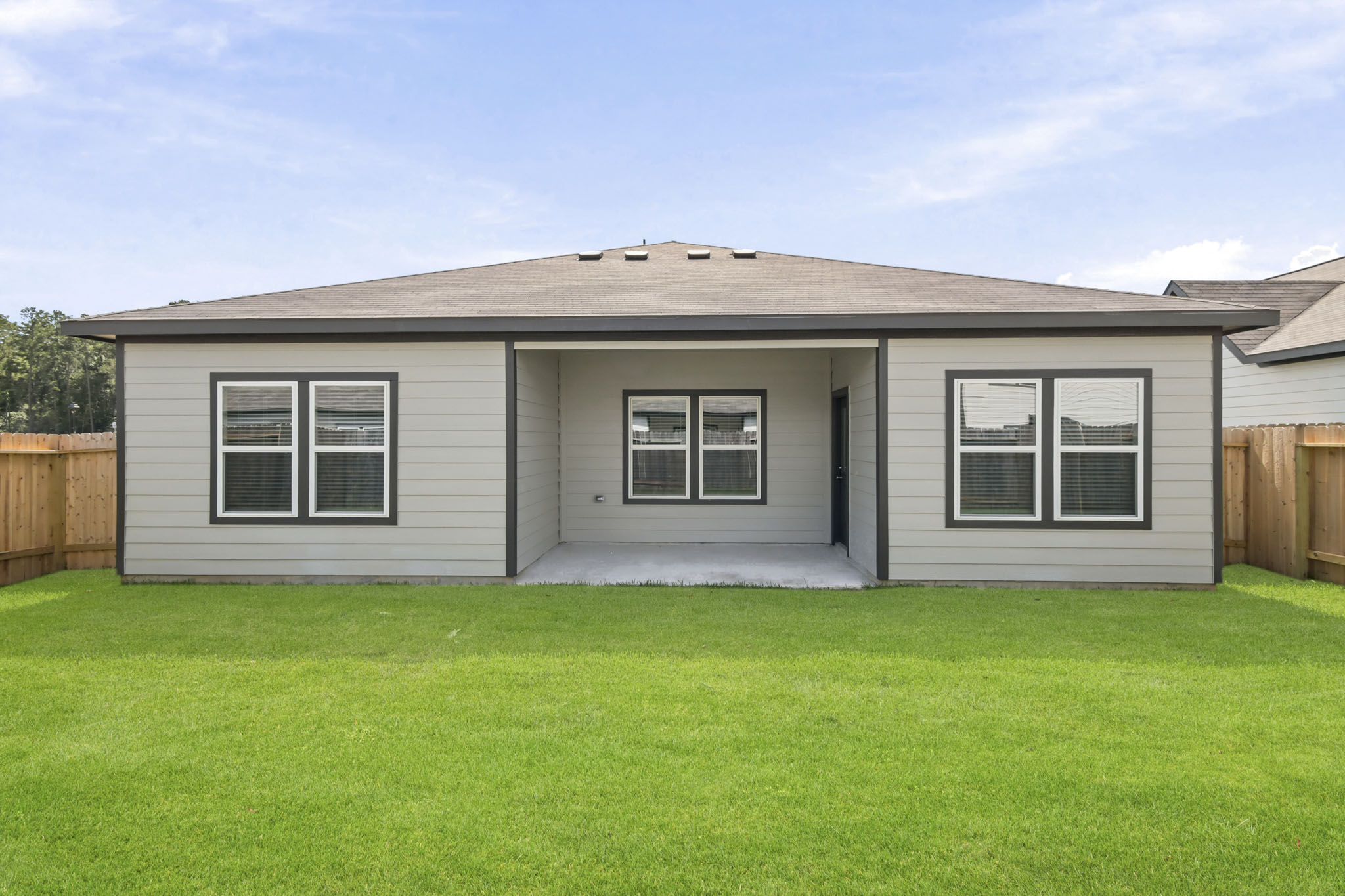 A house with a grass yard.