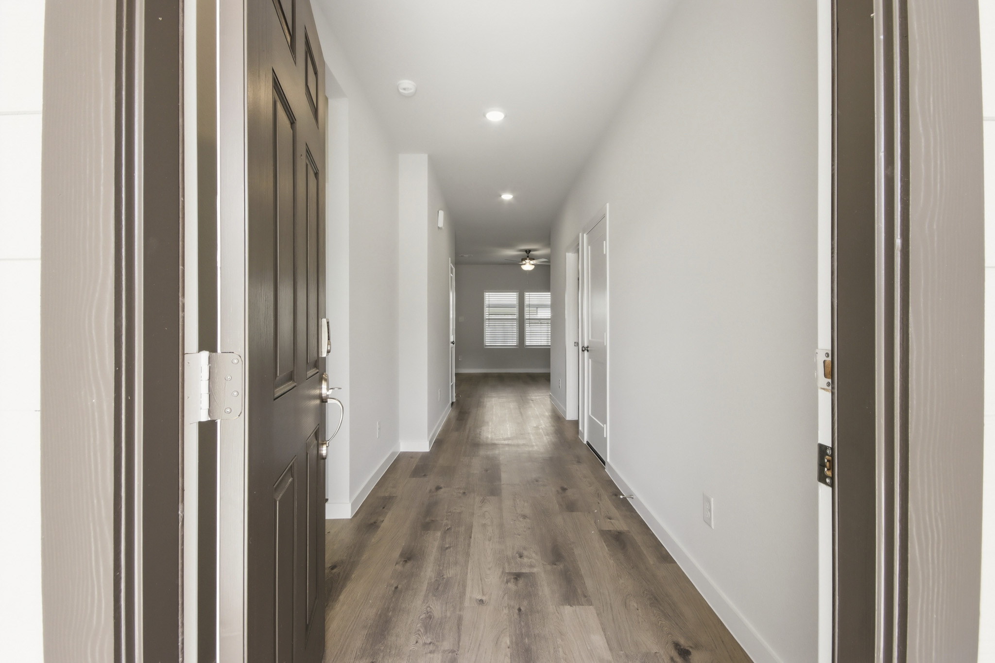 A hallway with white walls.