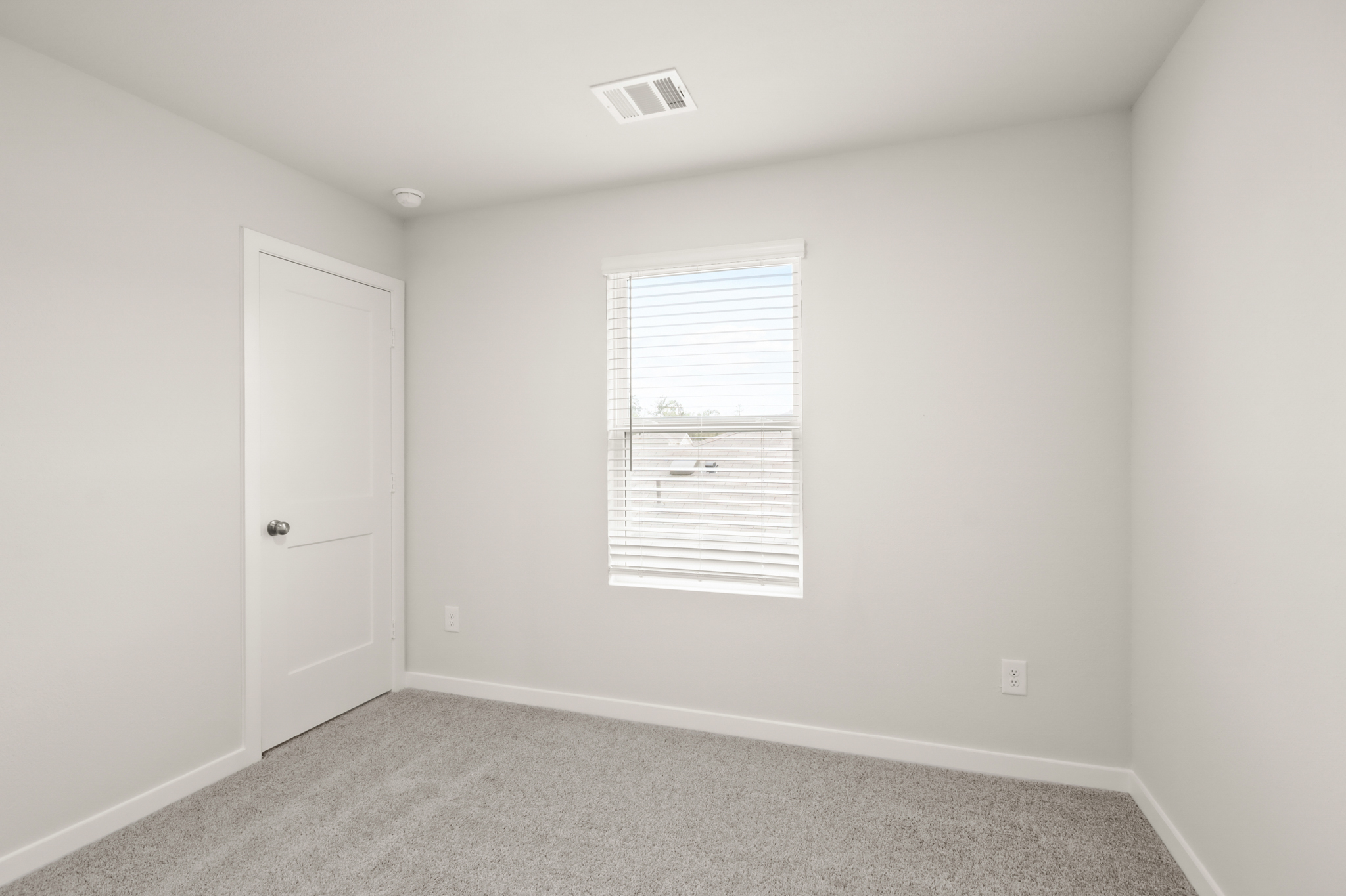 A room with a door and a window.