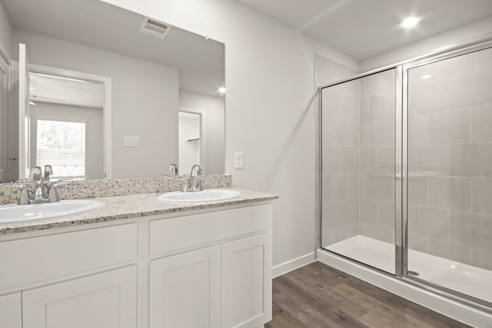 A bathroom with a glass shower.