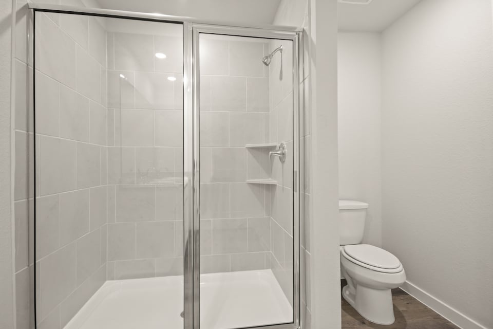 A bathroom with a glass shower.