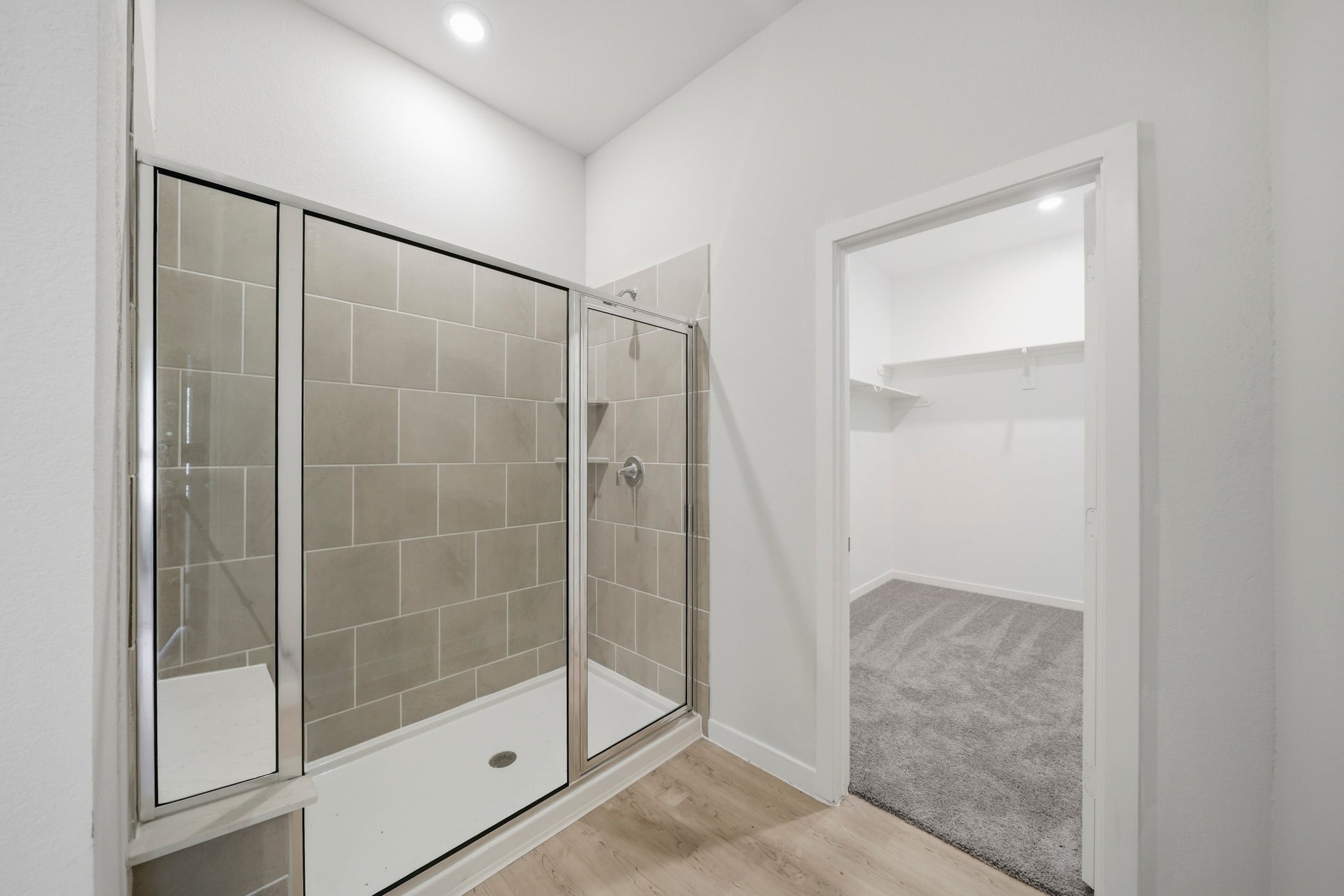 A bathroom with a glass shower.
