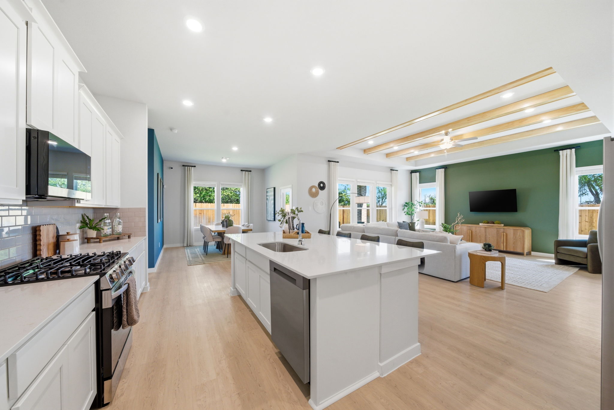 A large kitchen with white cabinets.