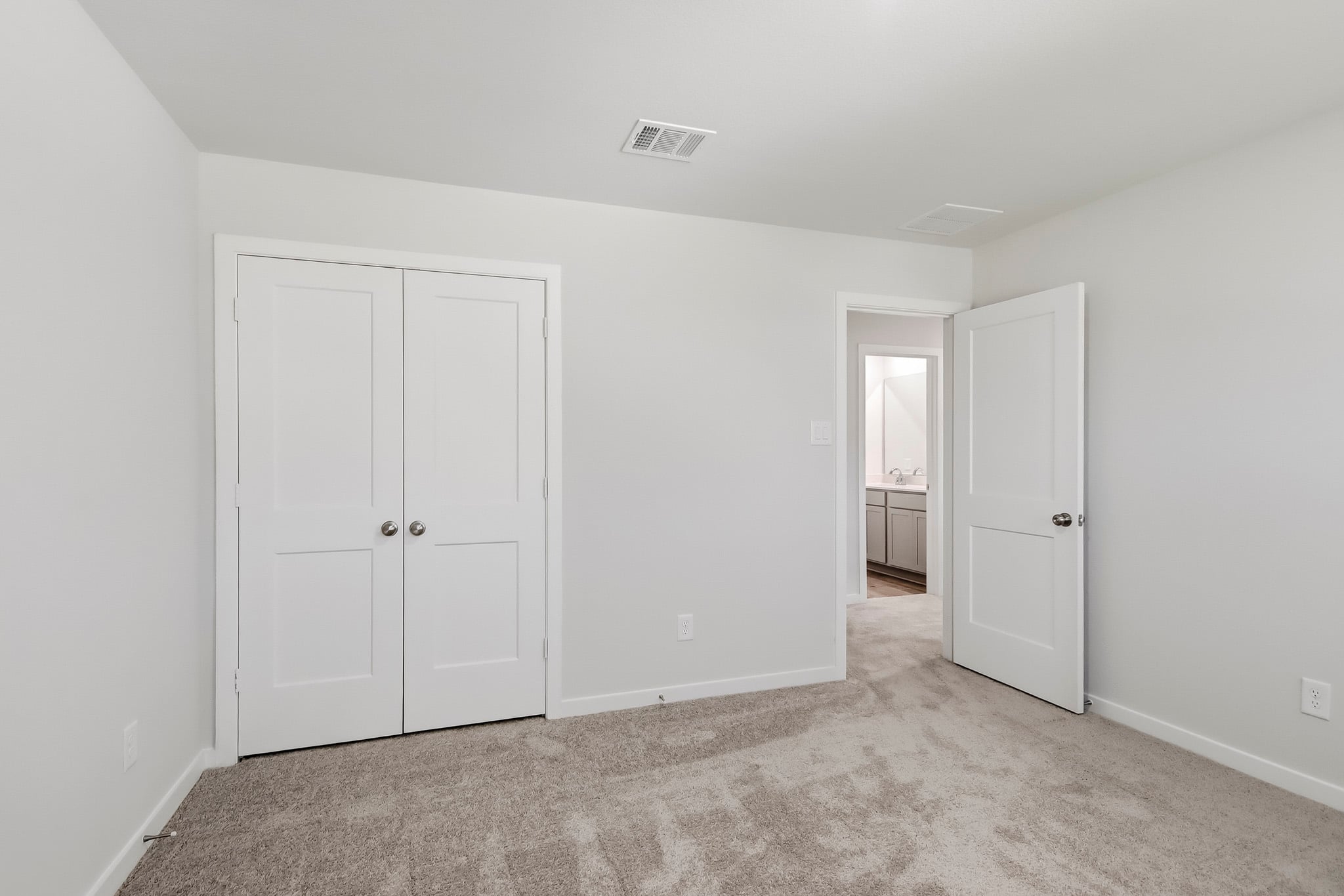 A room with white doors.