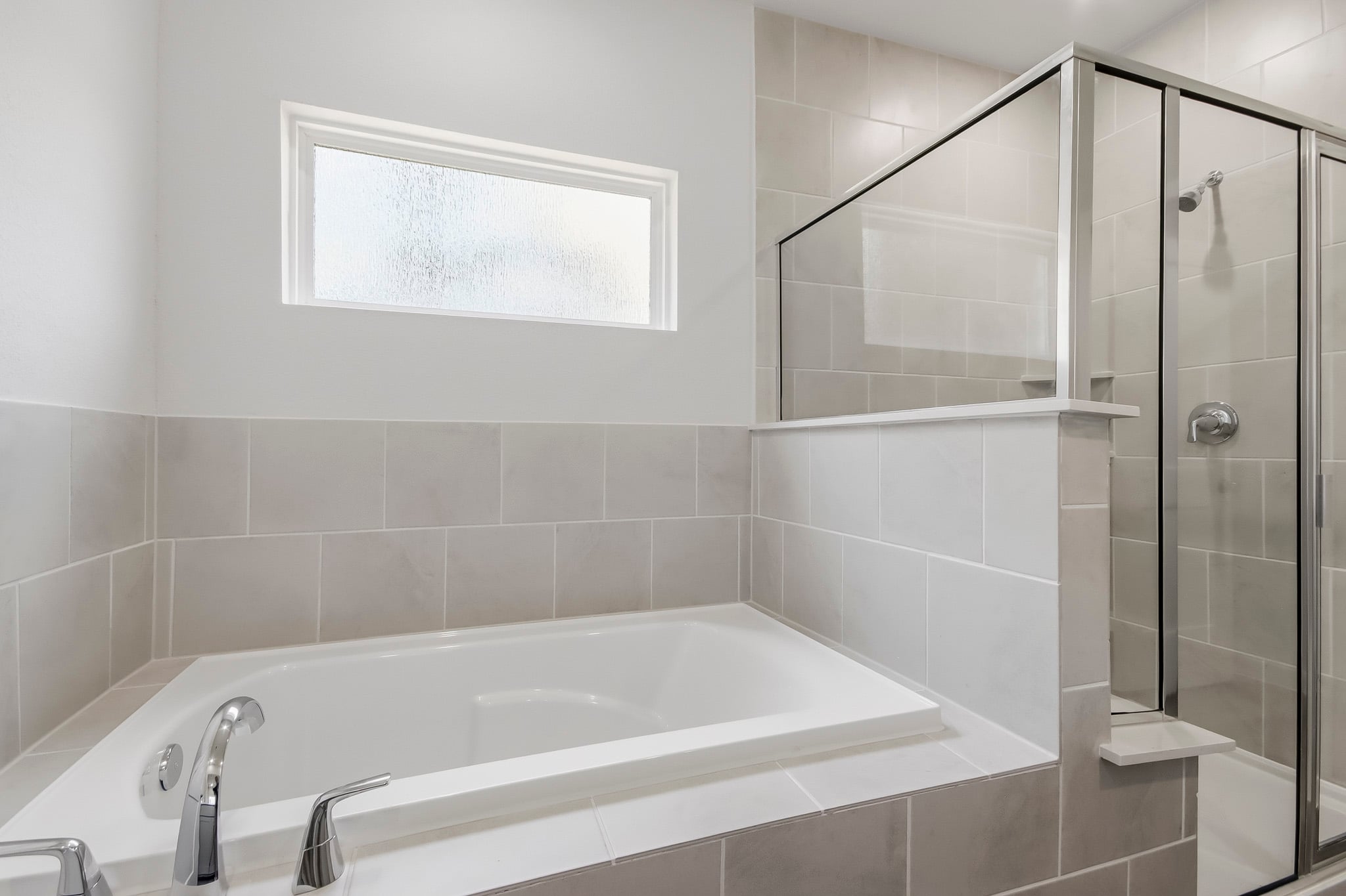 A bathroom with a glass shower.