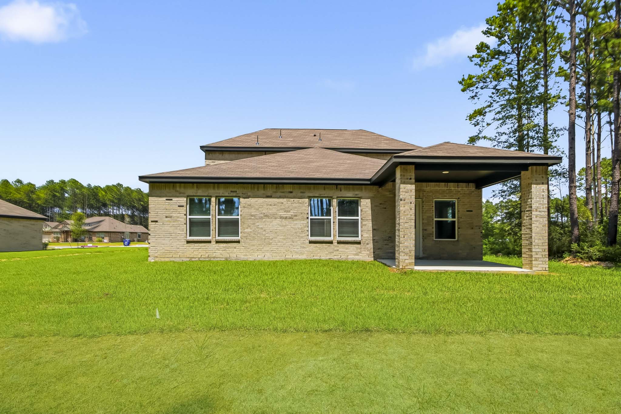 A house with a grass yard.