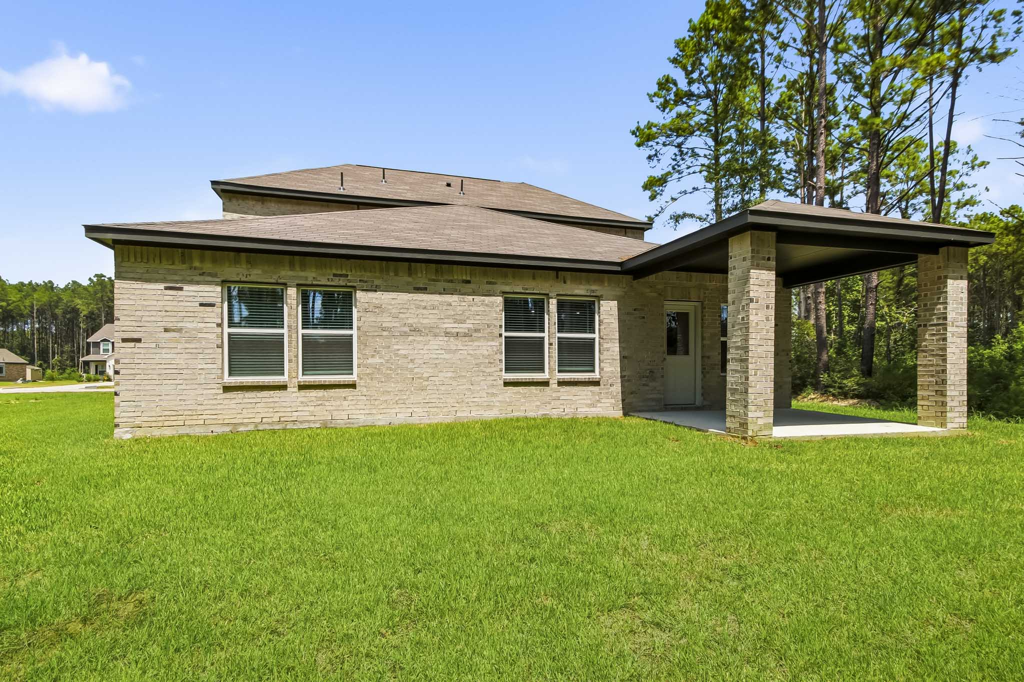 A house with a grass yard.
