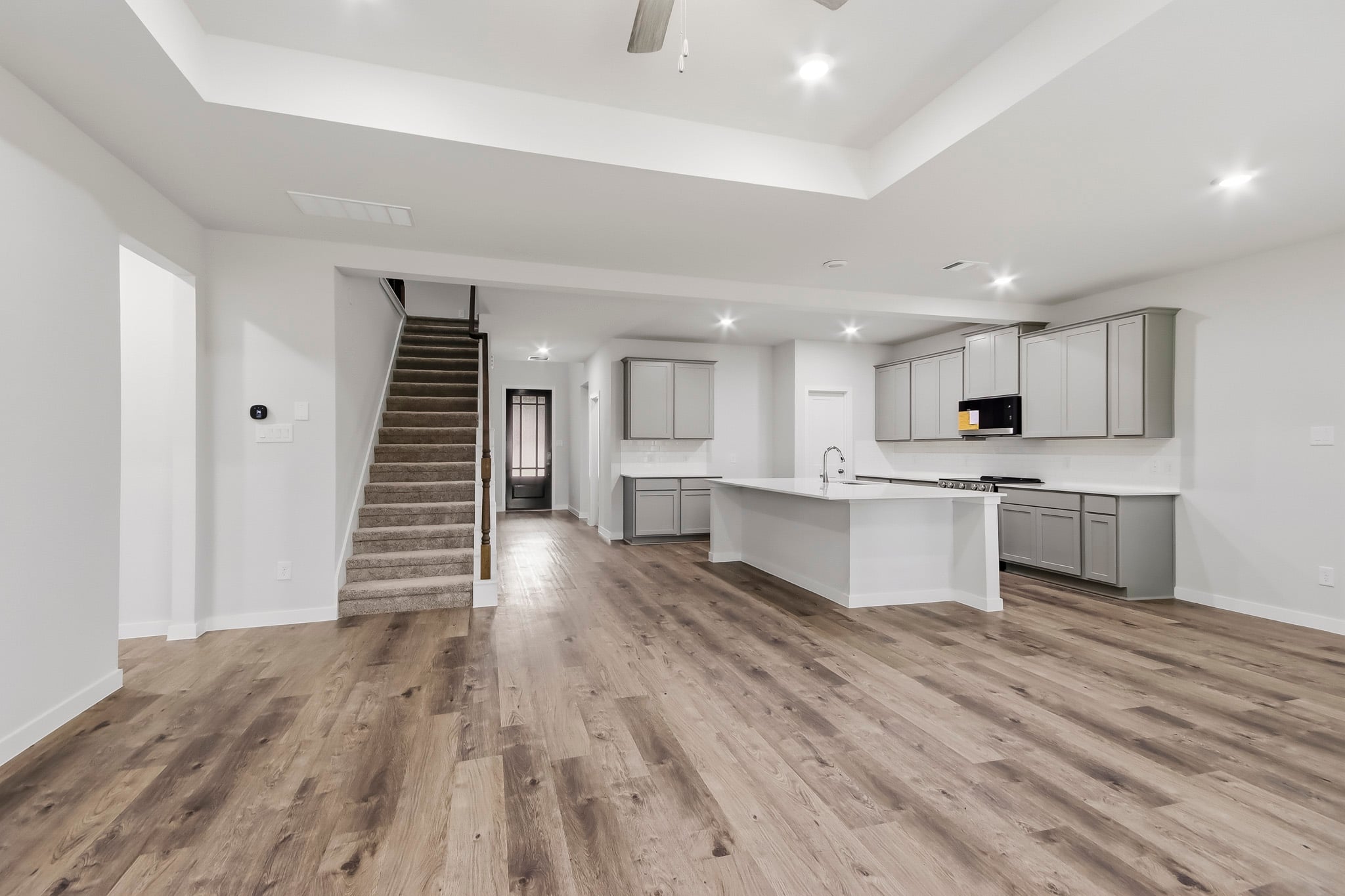 A large kitchen with white cabinets.