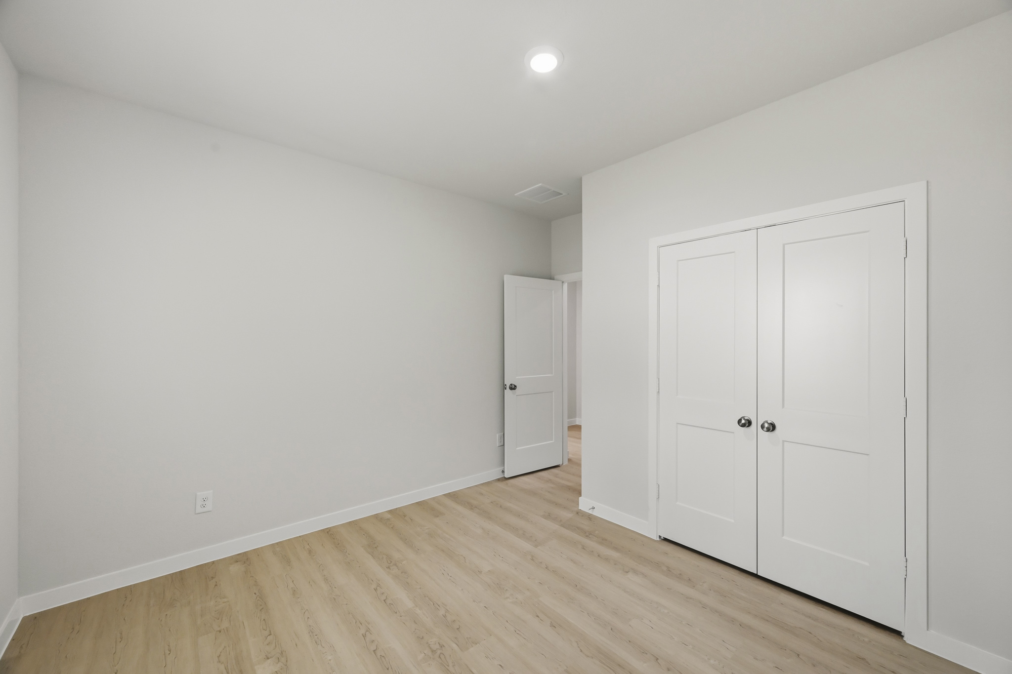 A room with white doors.