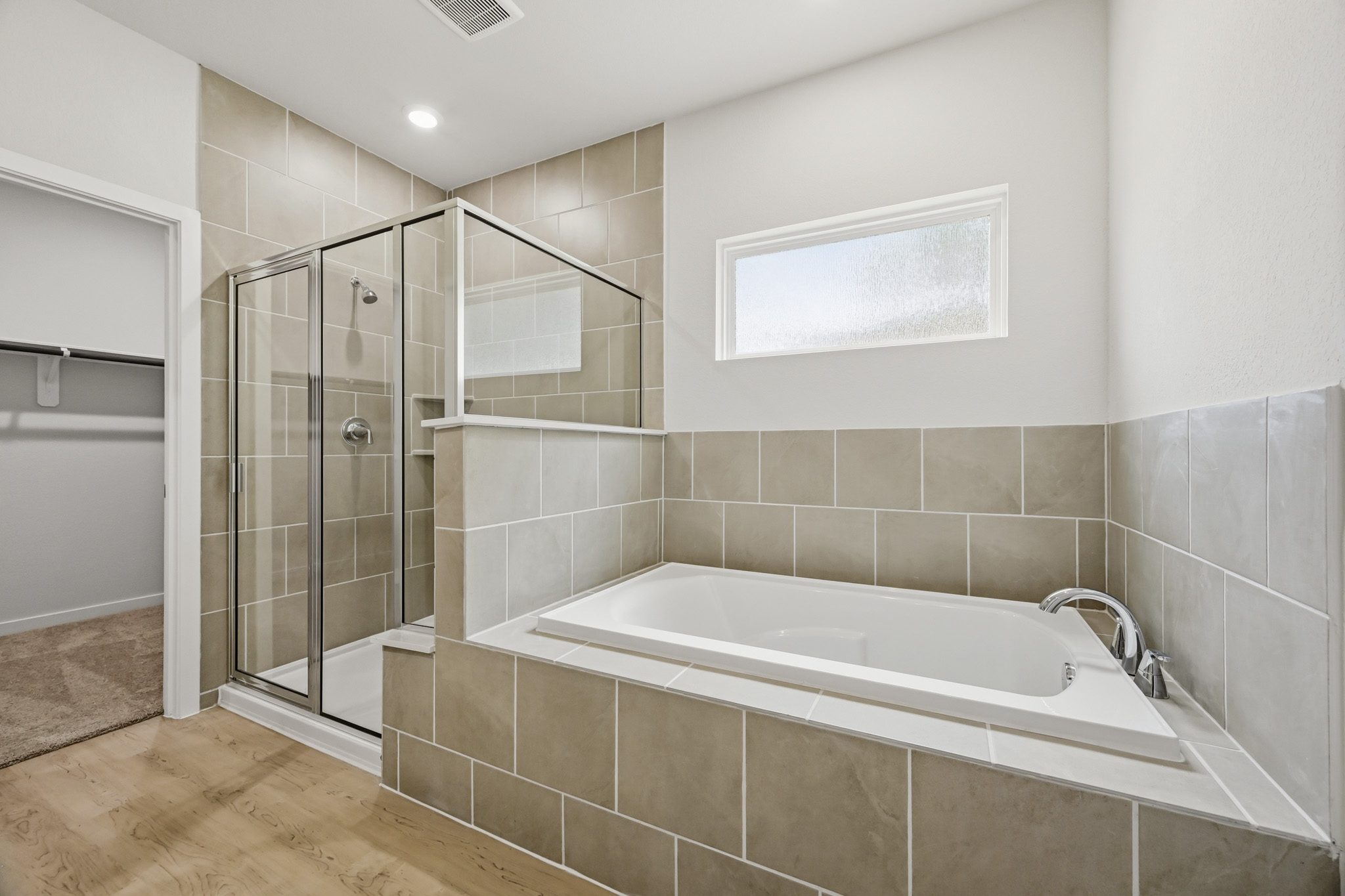 A bathroom with a glass shower.