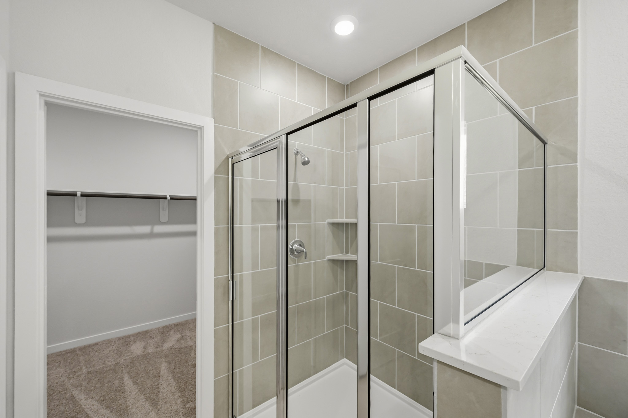 A bathroom with a glass shower.
