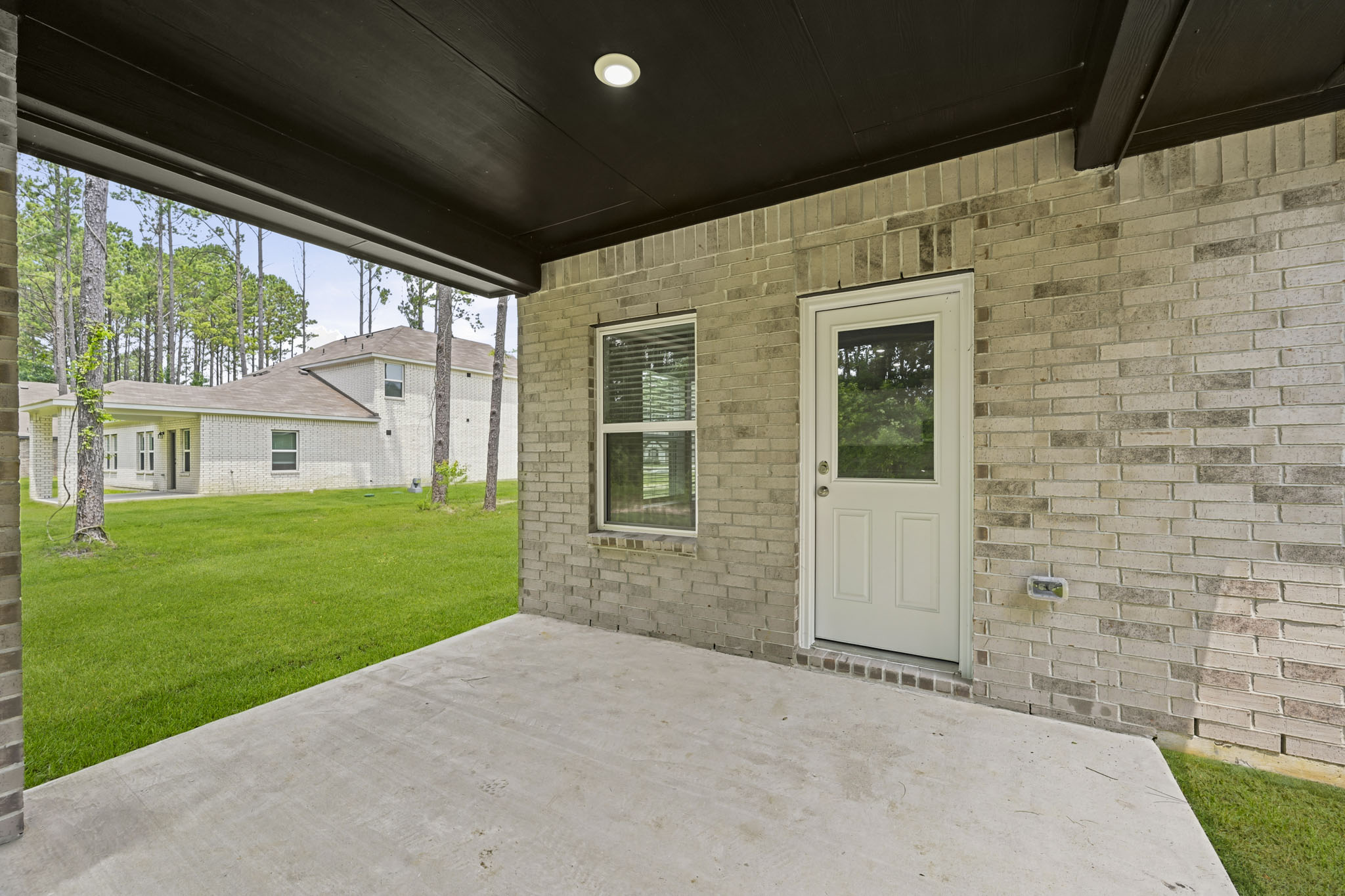 A house with a garage and a door.
