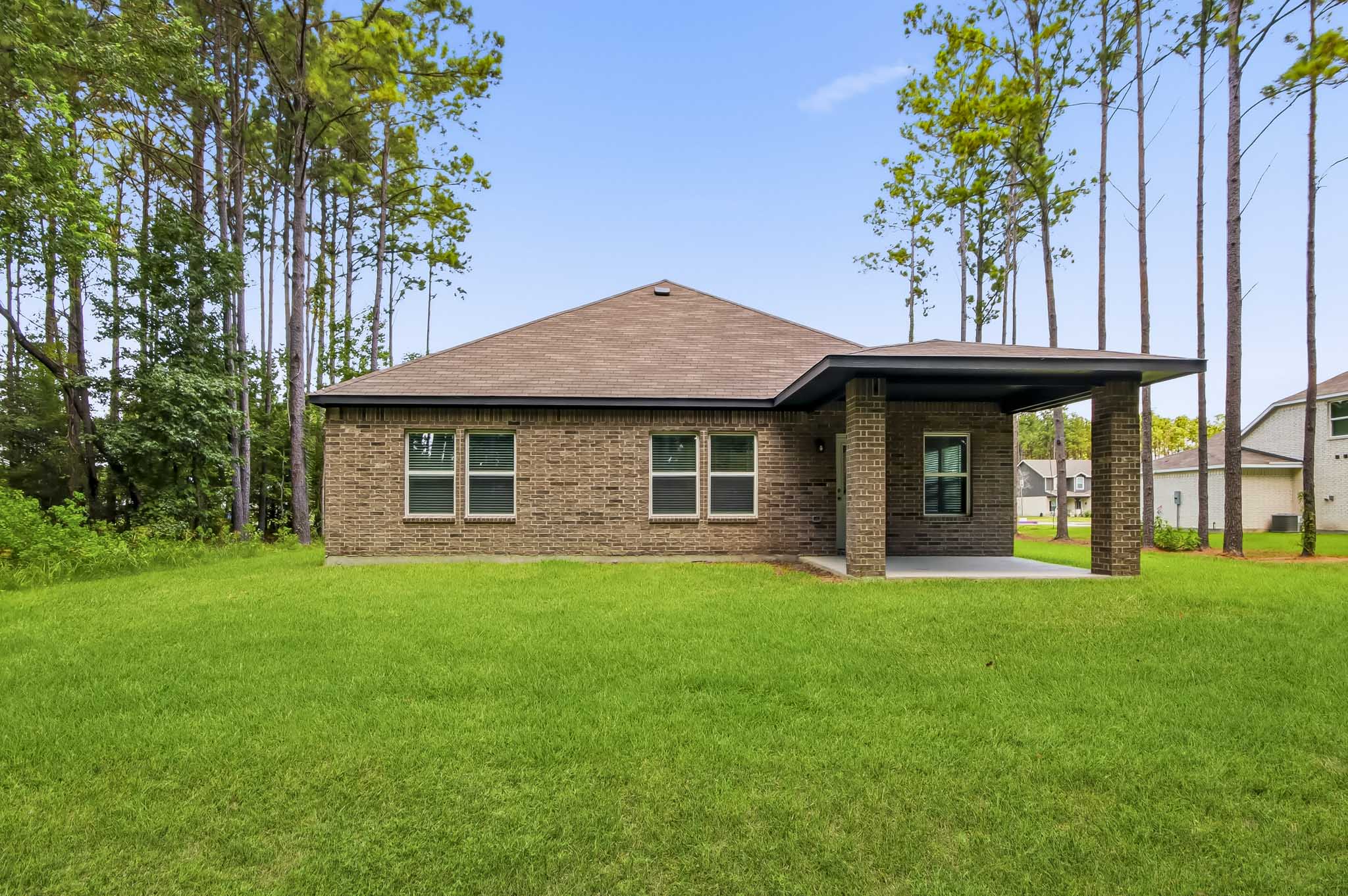 A house with a grass yard.