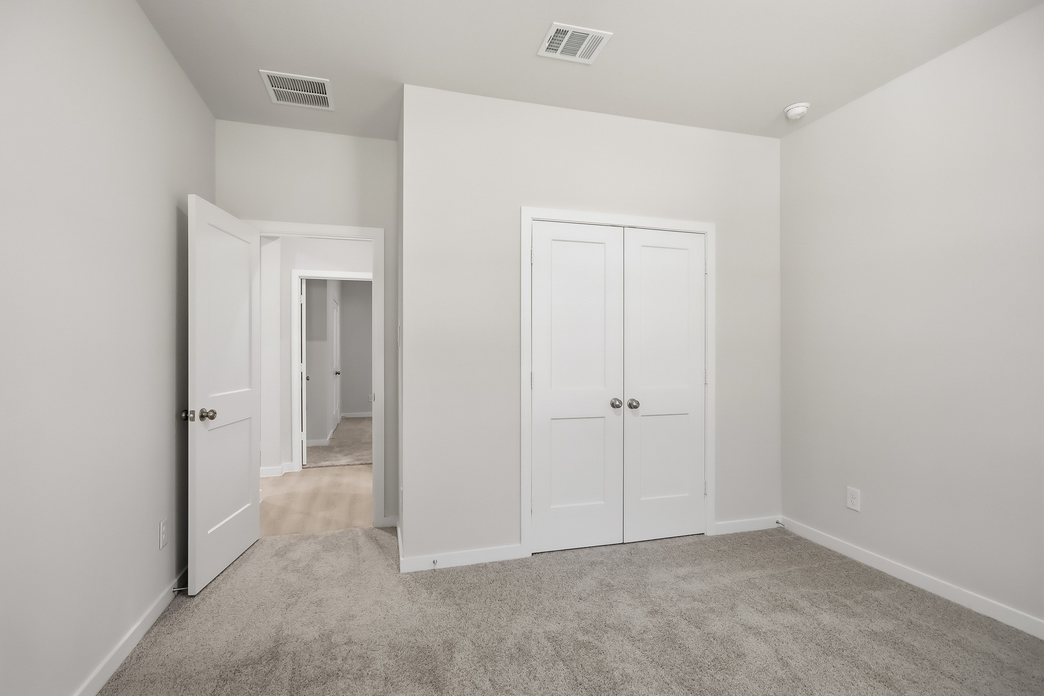 A room with white doors.