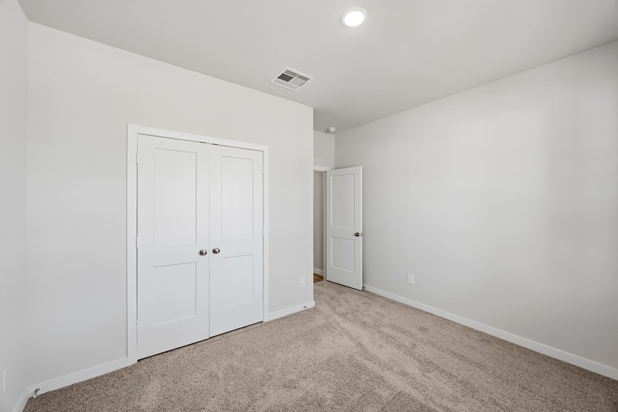 A room with white doors.