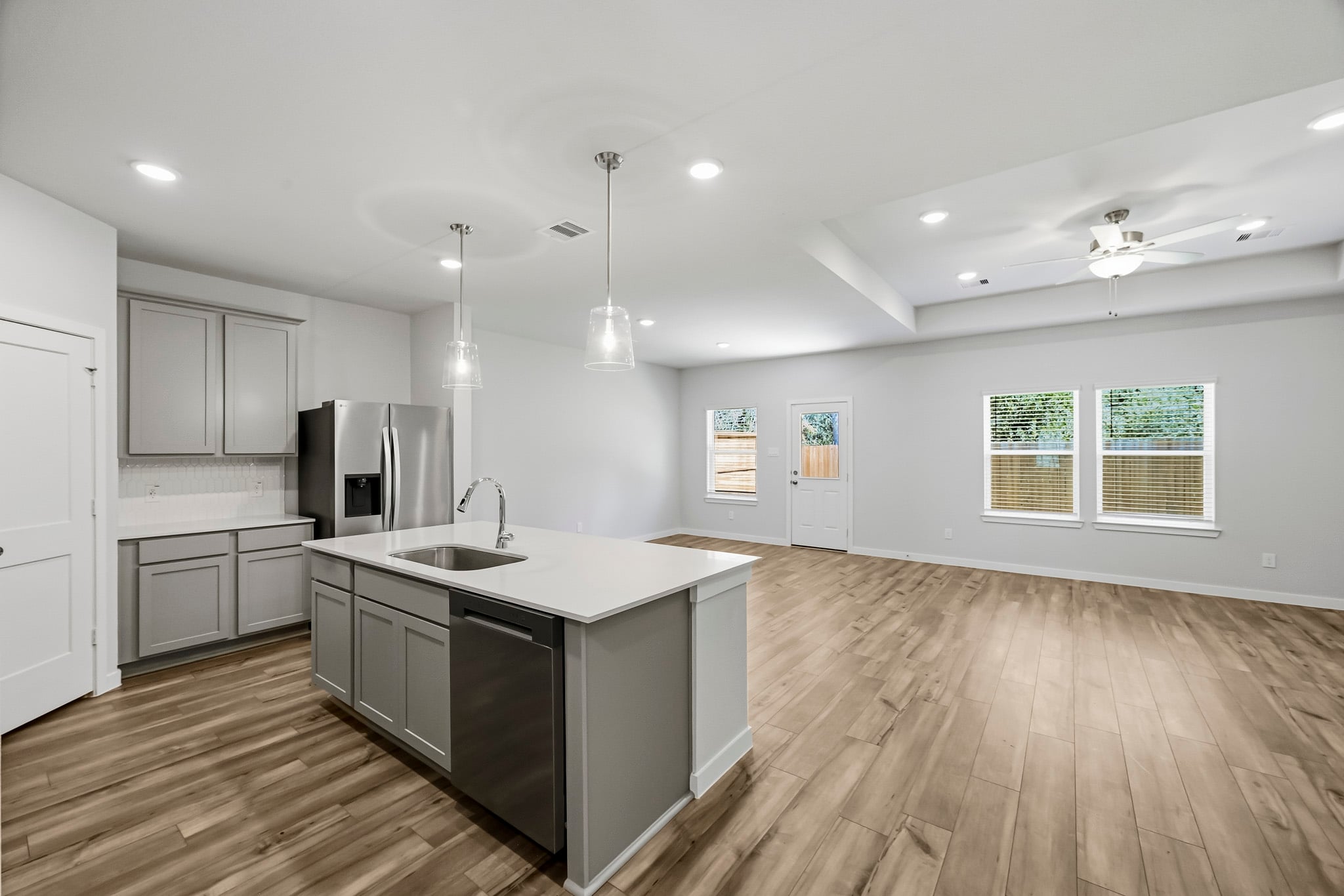 A kitchen with wooden floors.