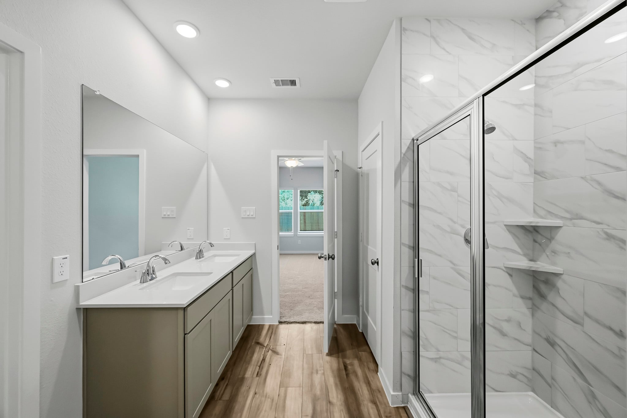 A bathroom with a glass shower.