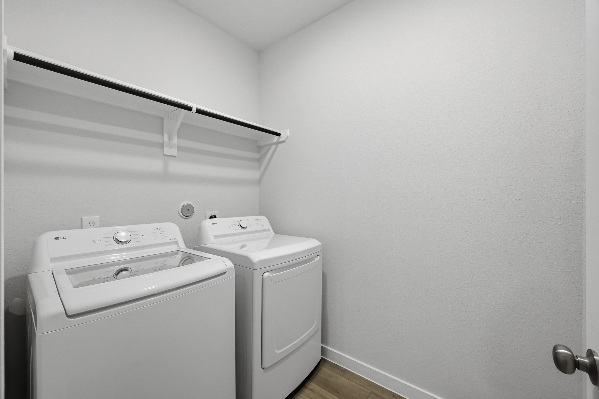 A washing machine in a room.