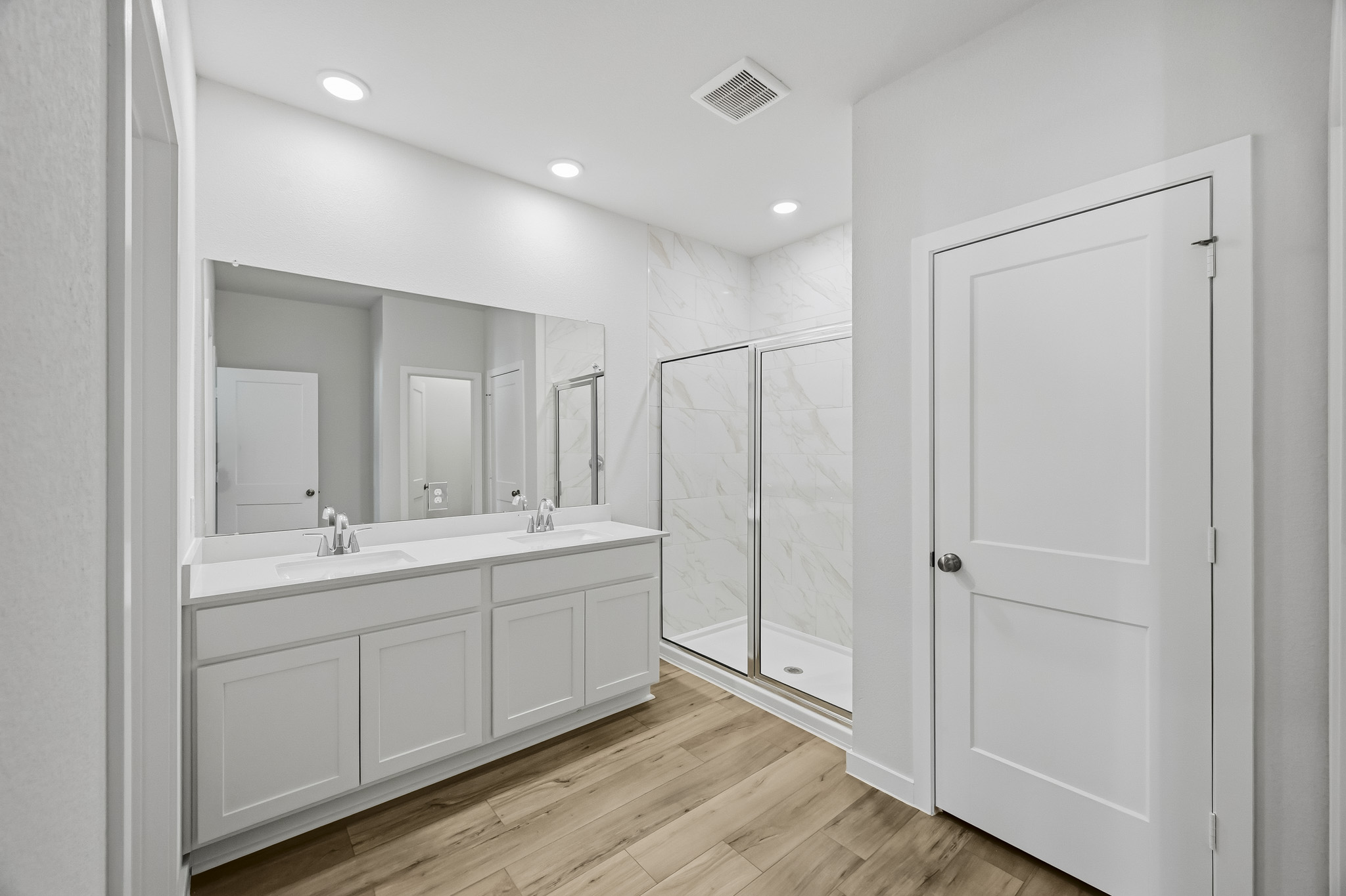 A bathroom with a glass shower.
