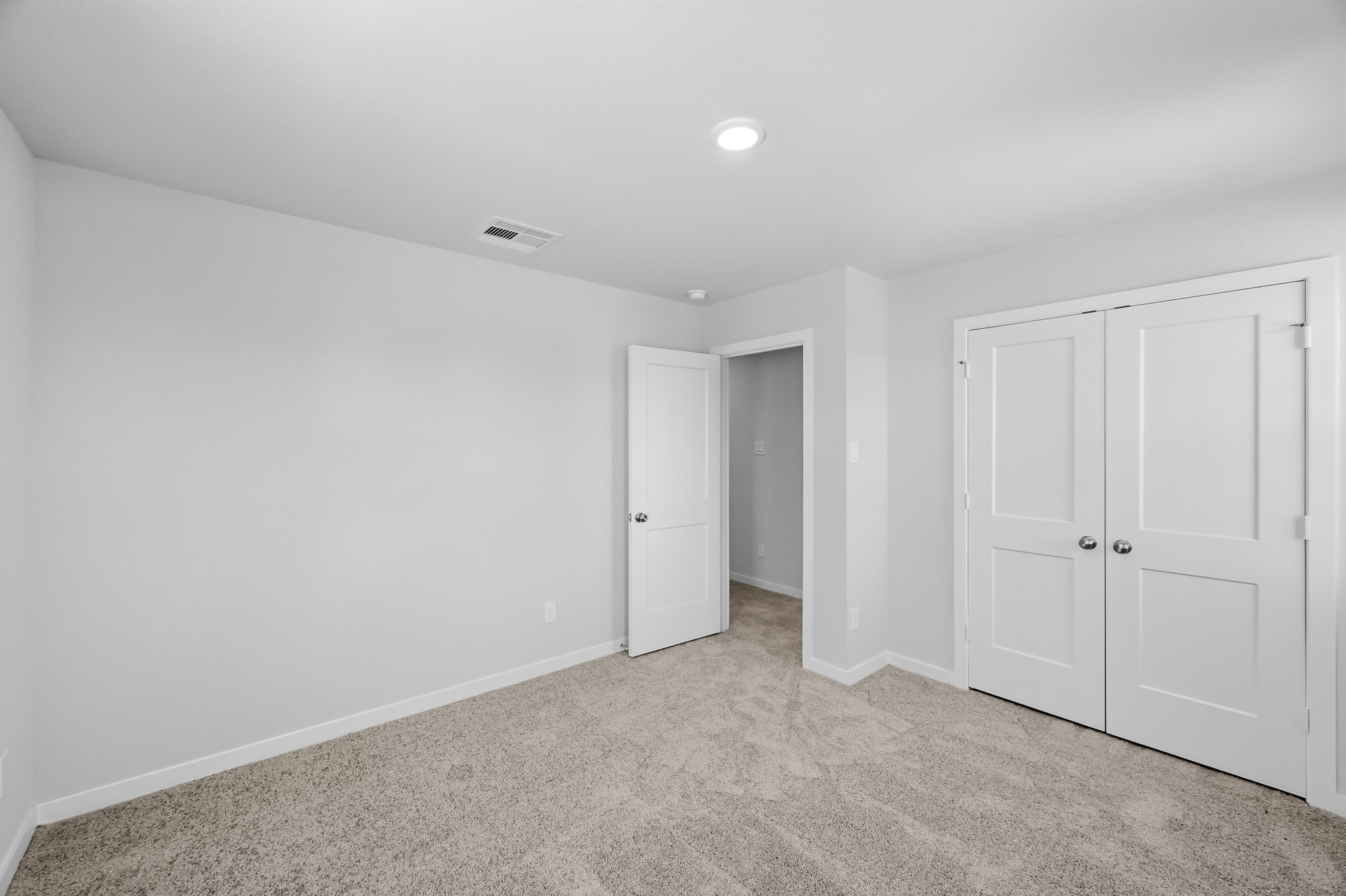 A room with white doors.