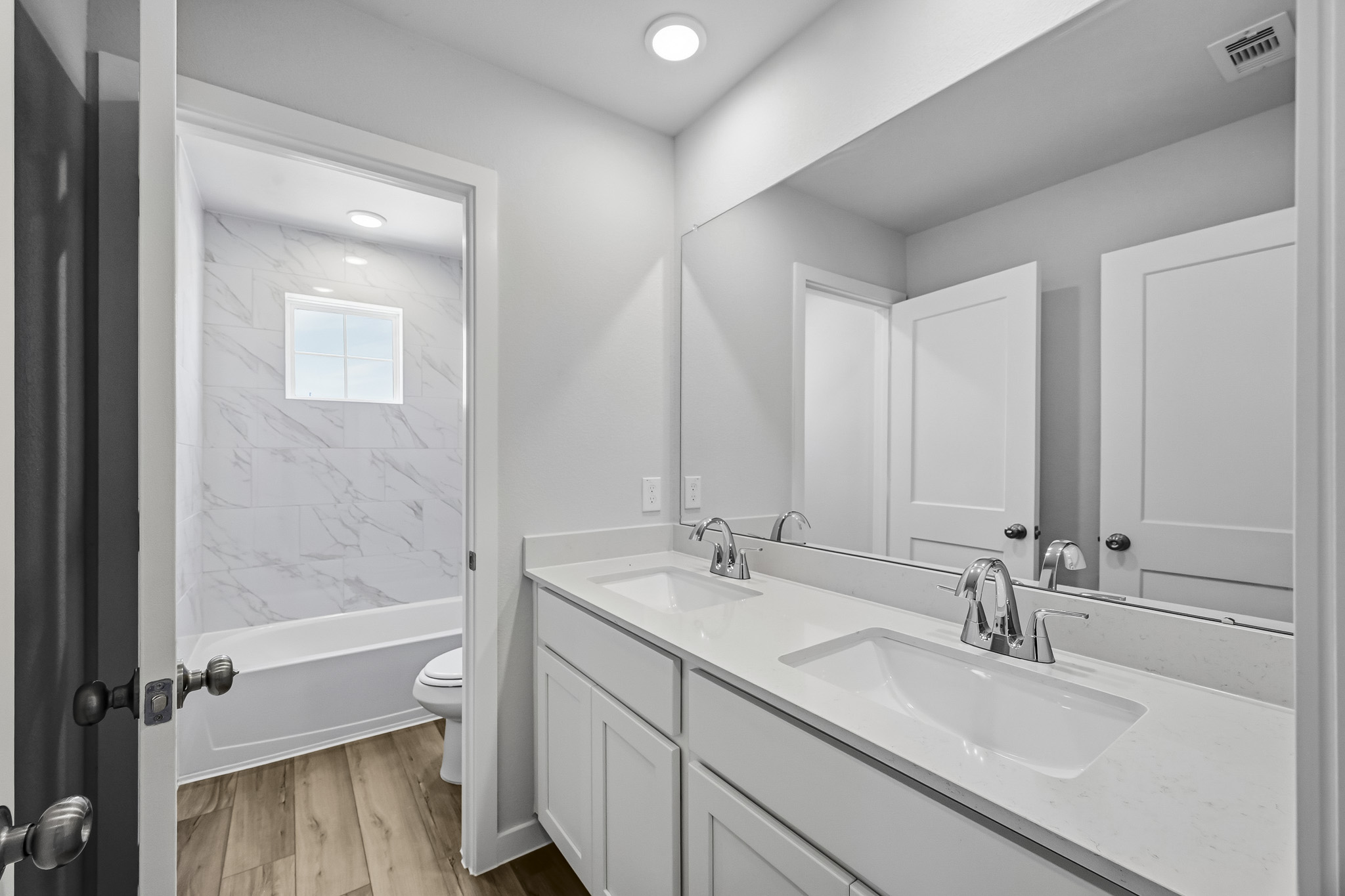 A bathroom with a sink and a toilet.