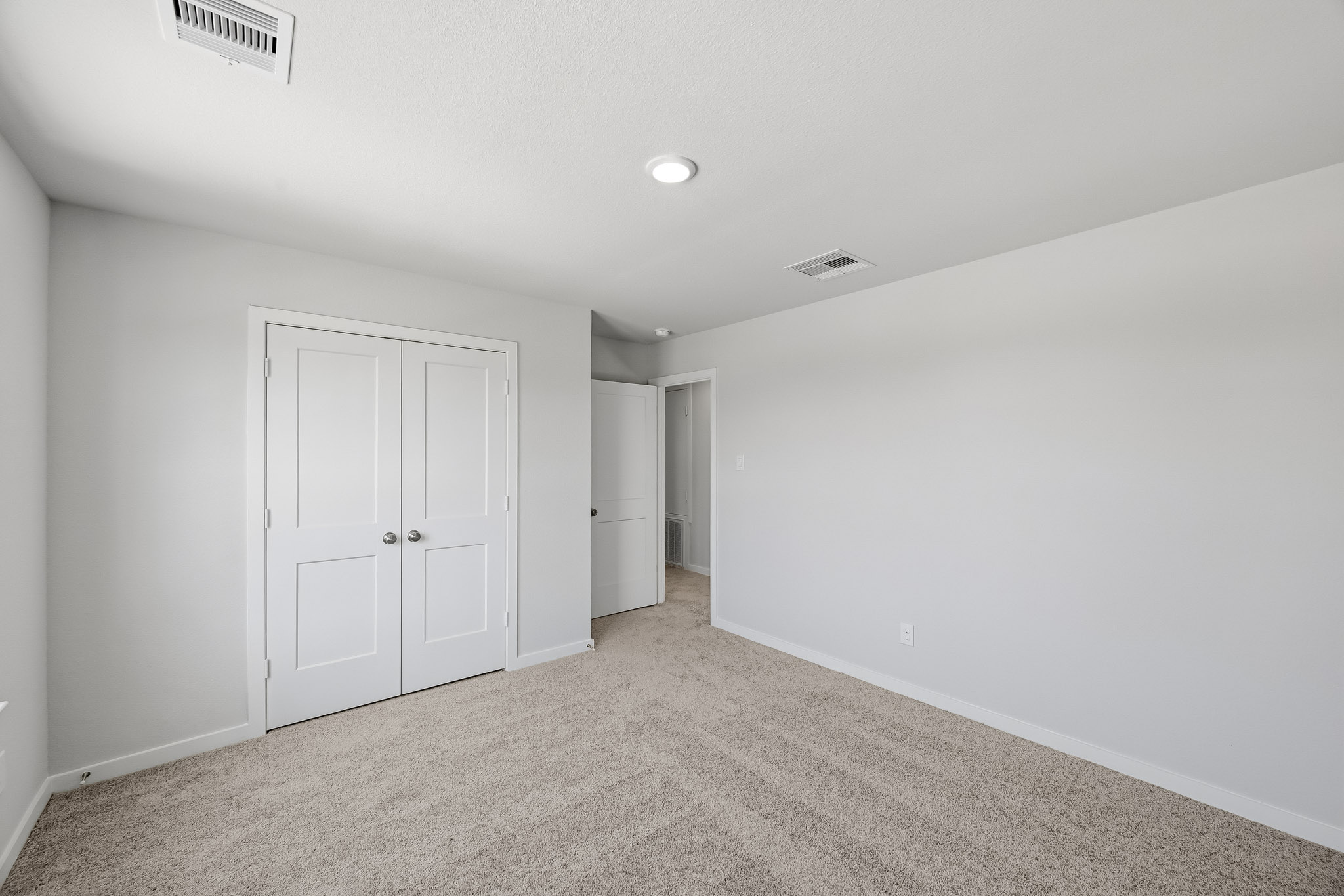 A room with white doors.