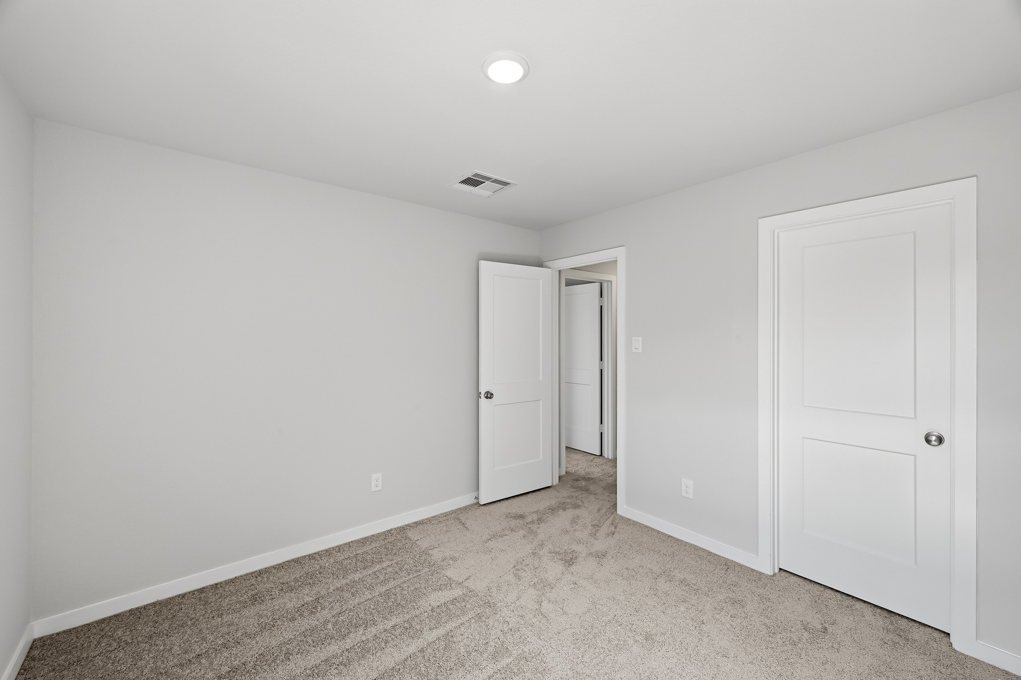 A room with white doors.