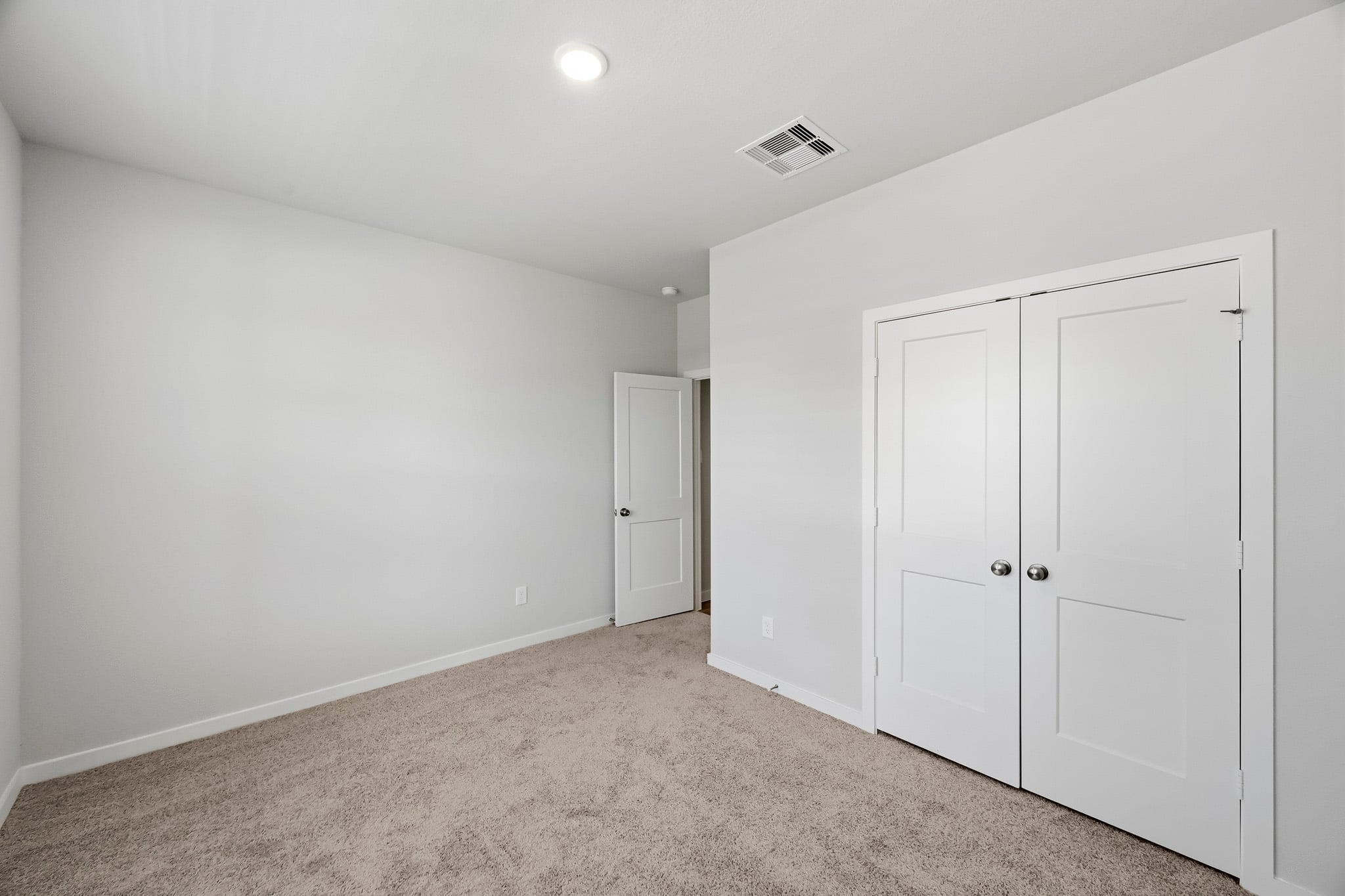 A room with white doors.
