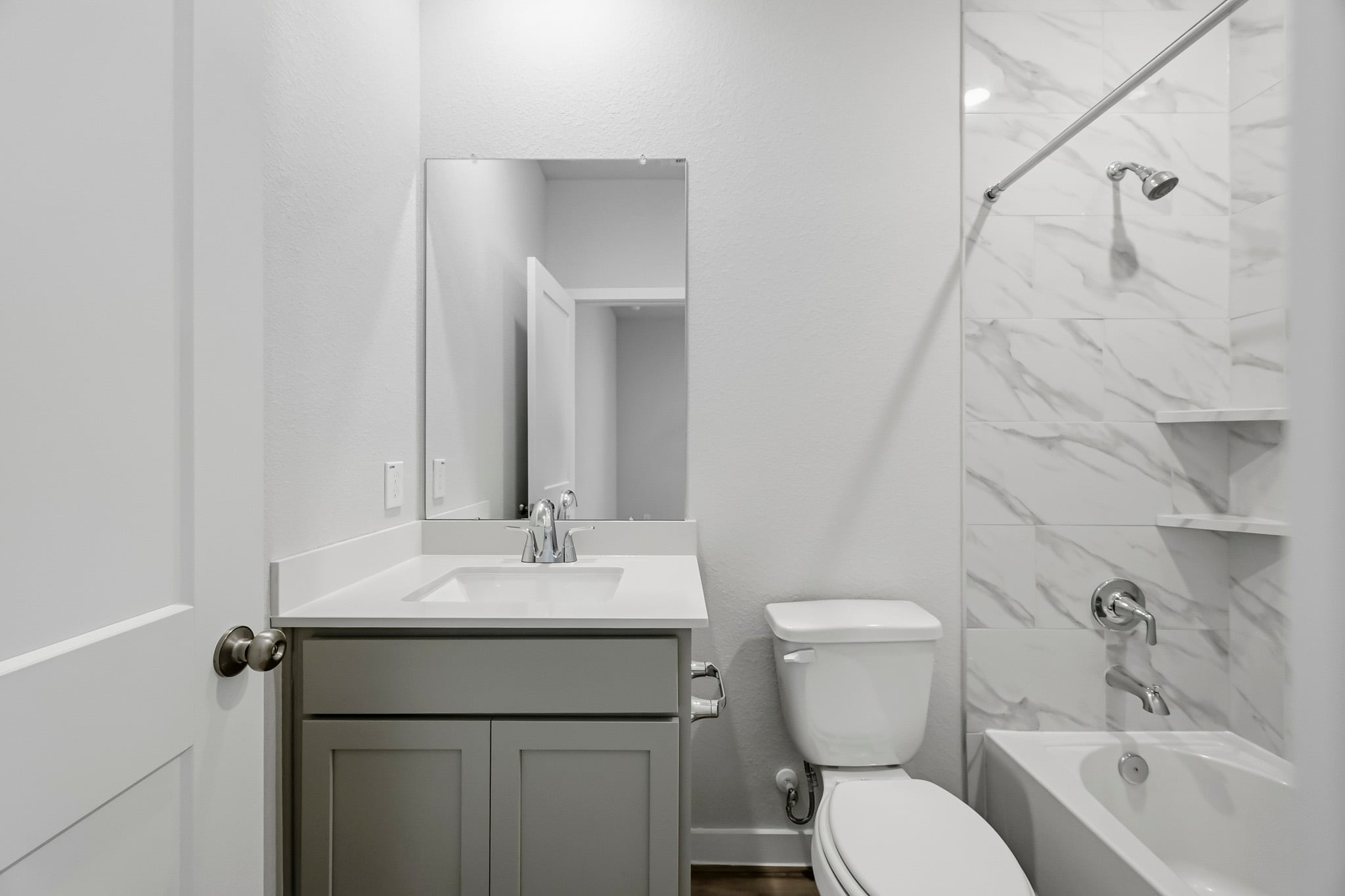 A bathroom with a glass shower.