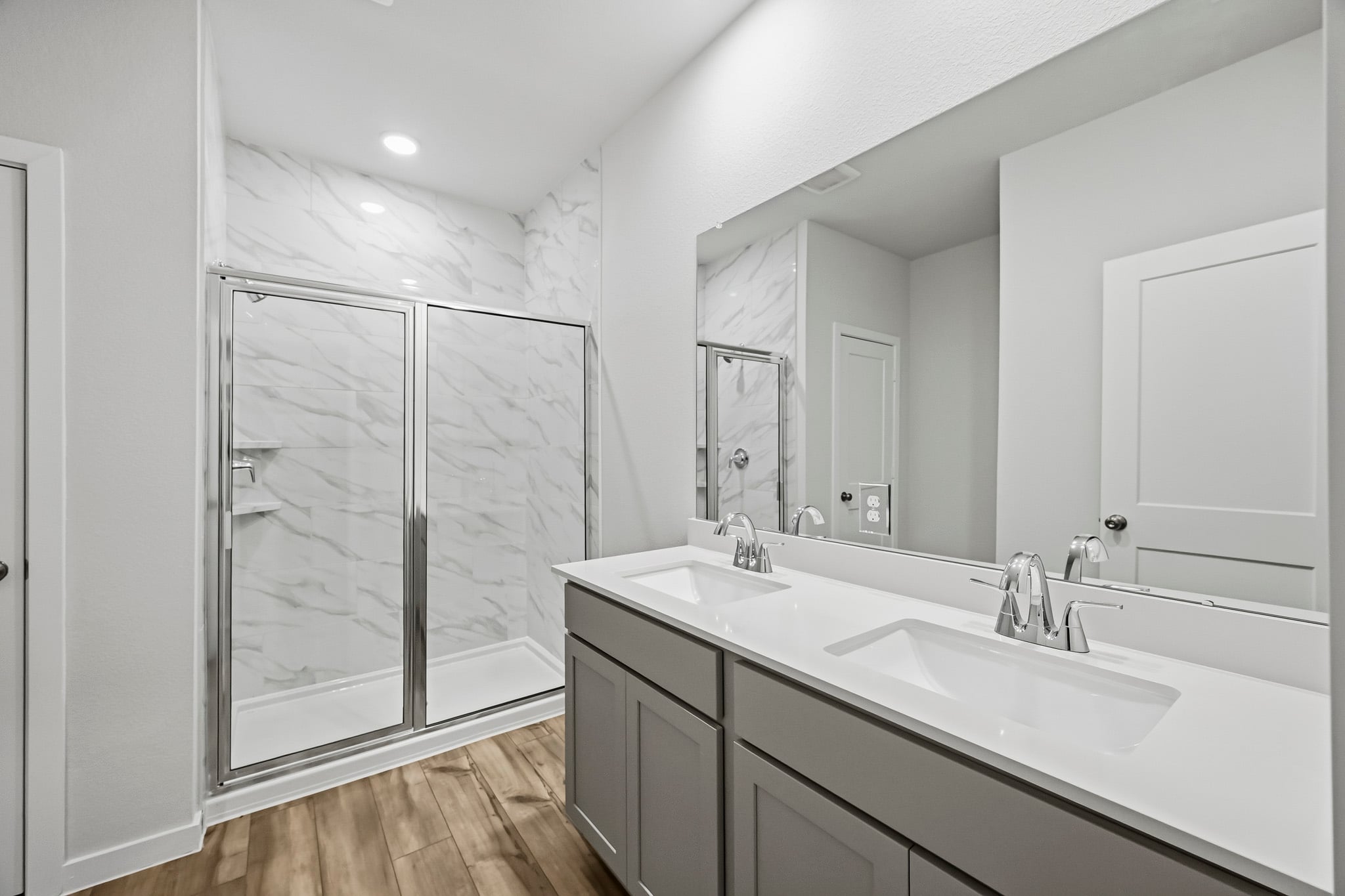 A bathroom with a glass shower.