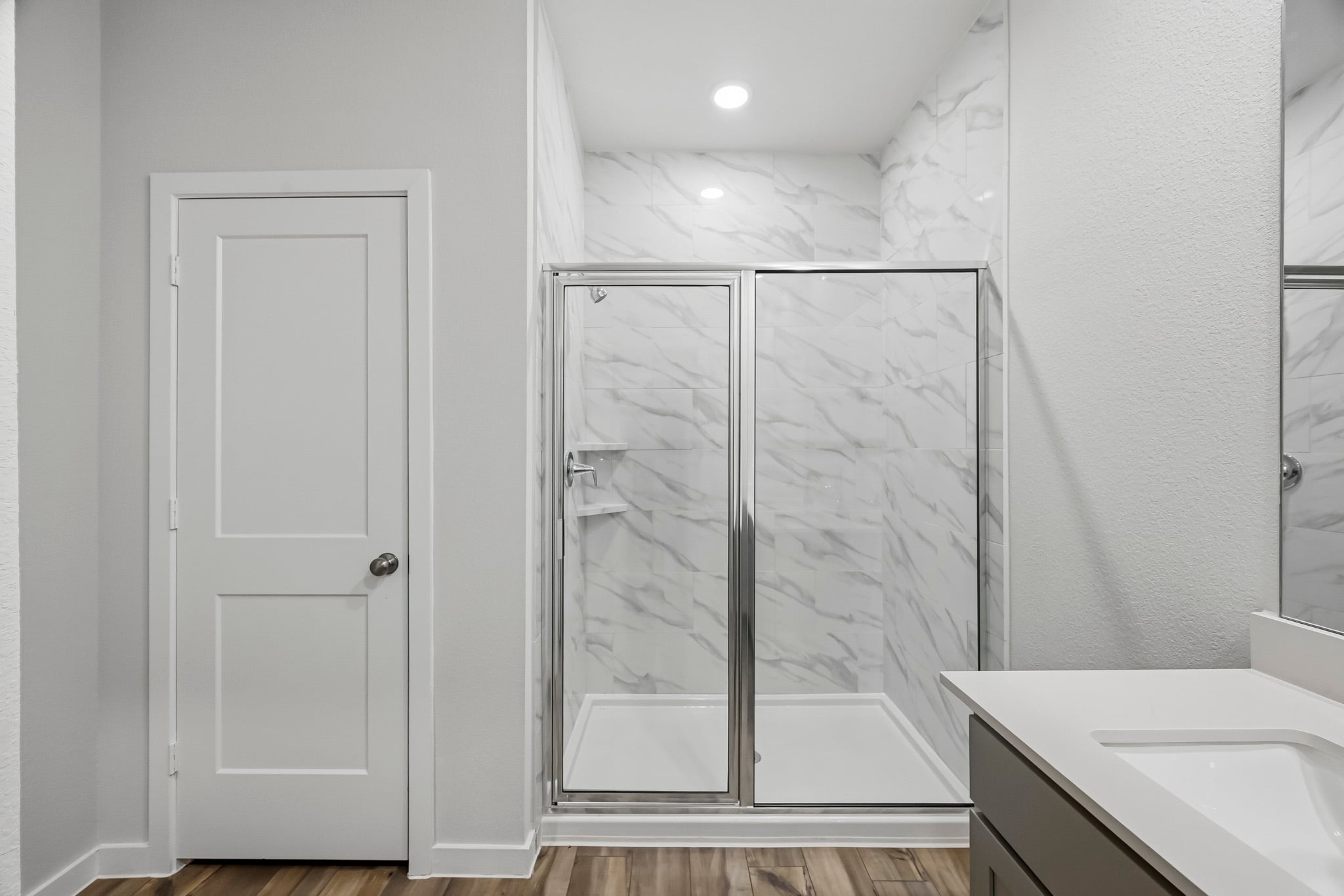 A bathroom with a glass shower.