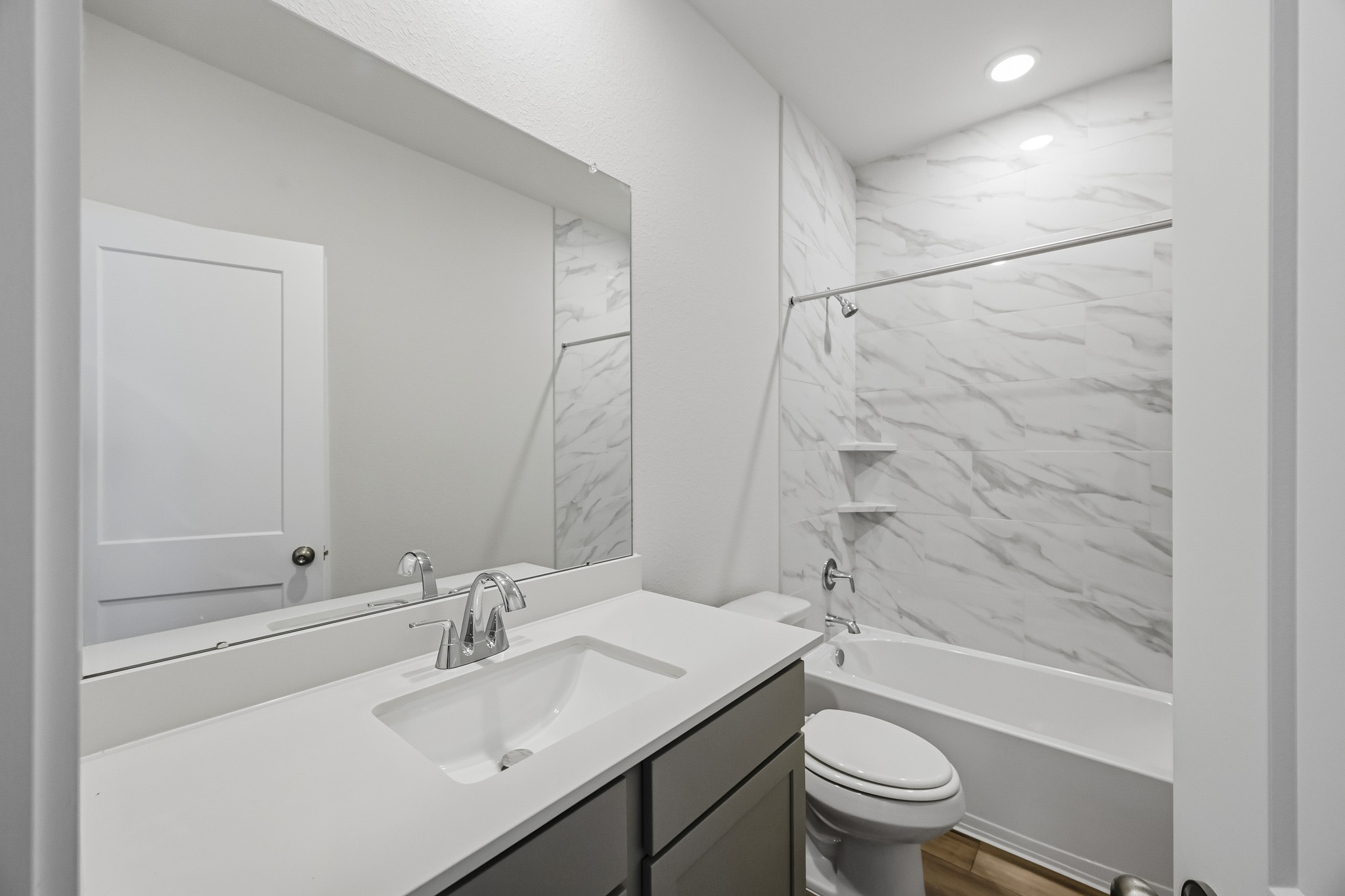 A bathroom with a sink and a toilet.