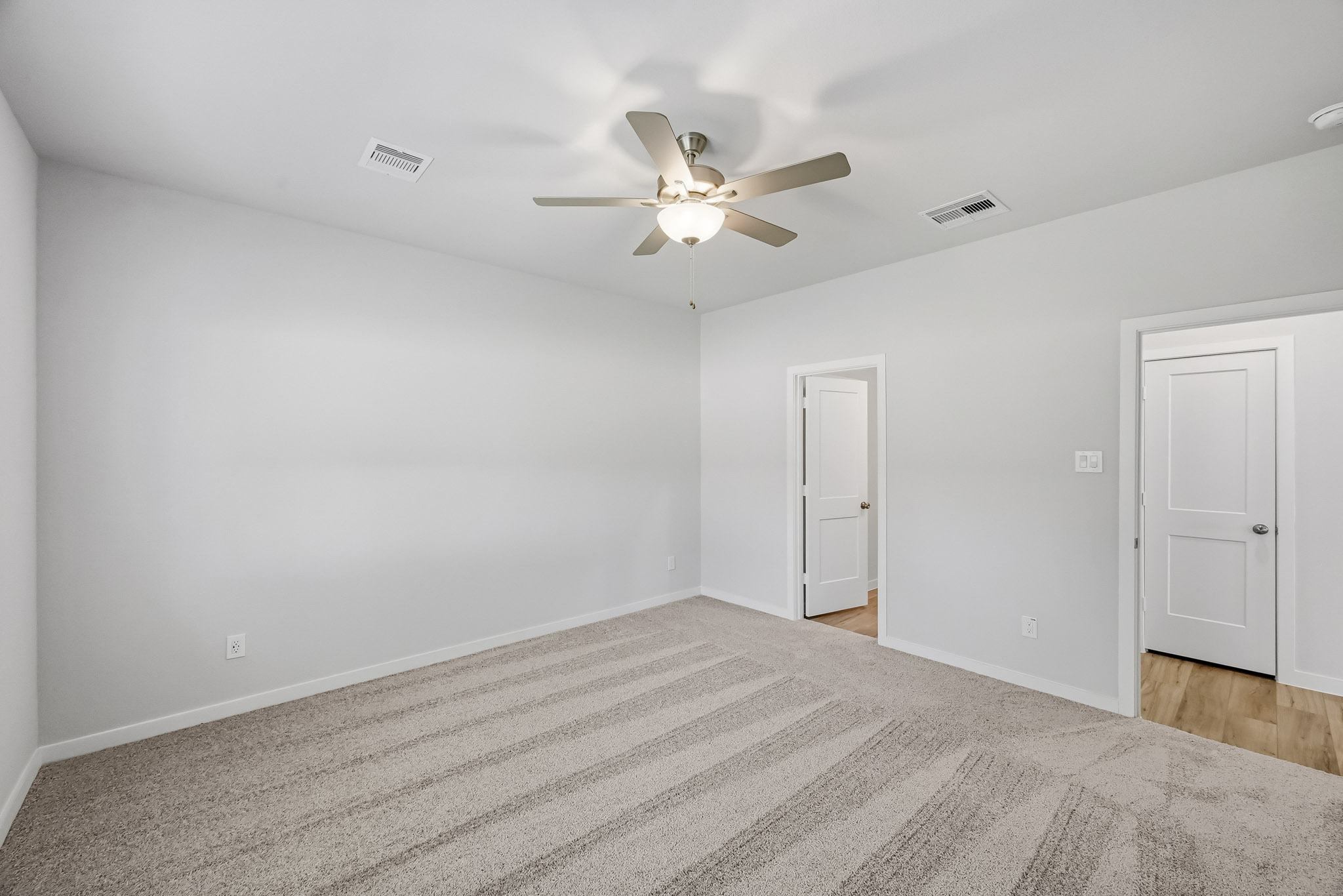 A ceiling fan in a room.