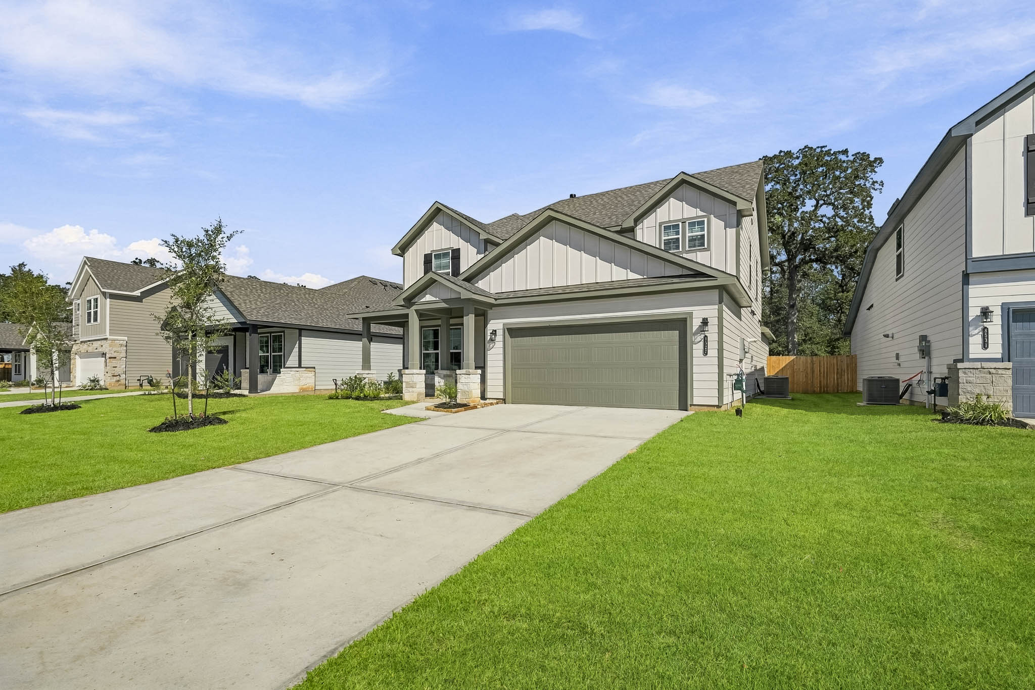 A house with a green lawn.