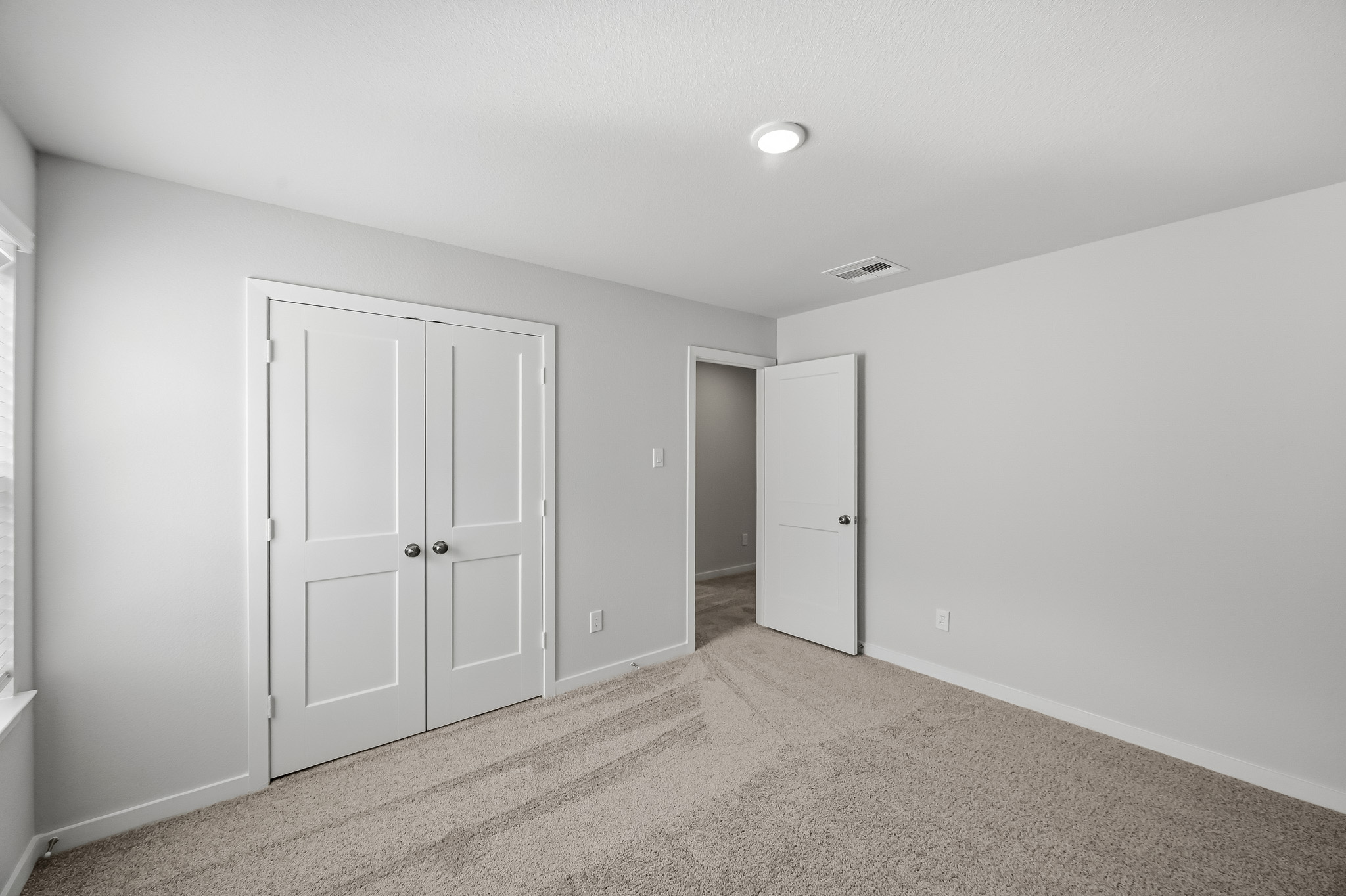 A room with white doors.