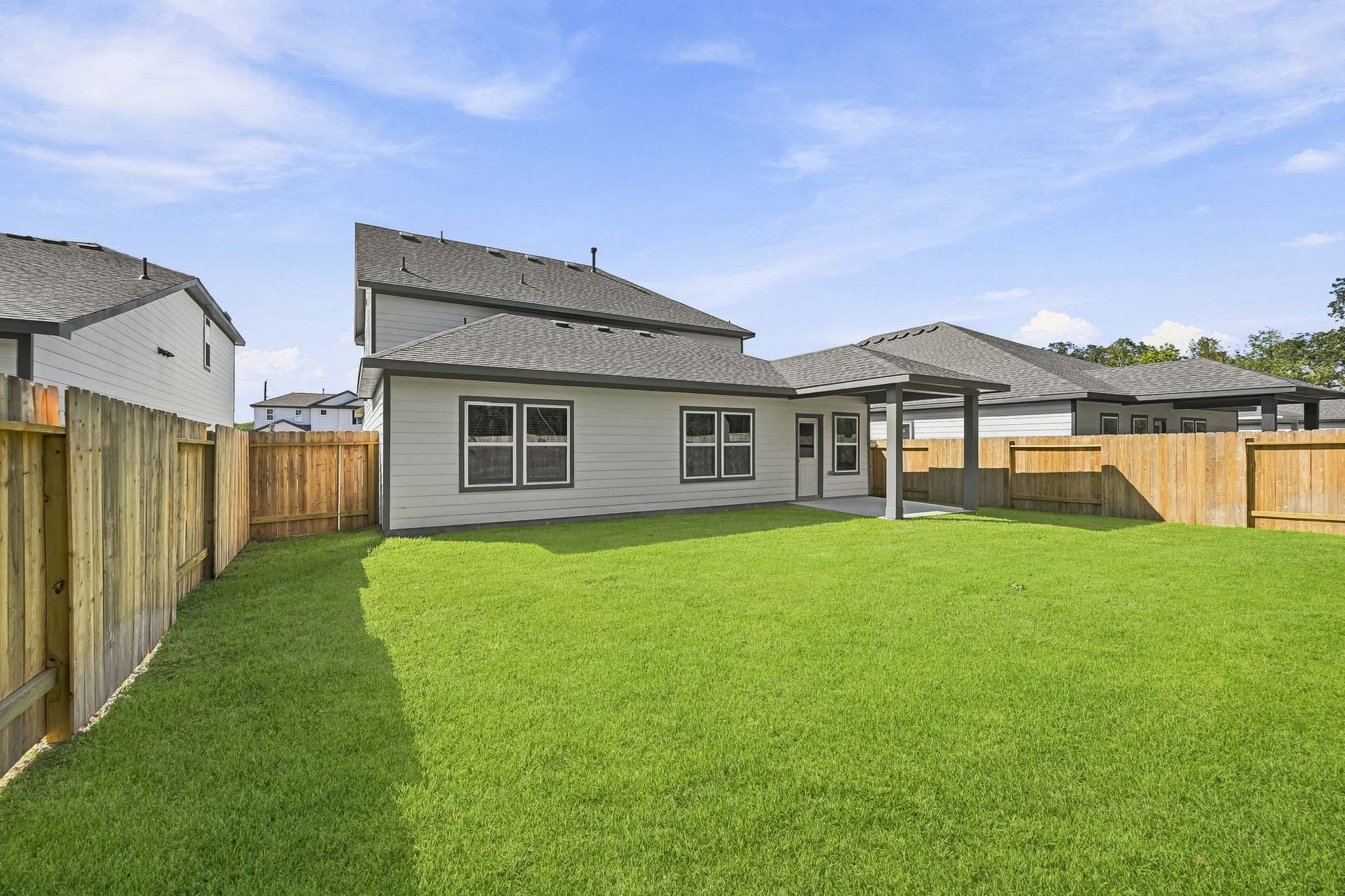 A house with a fence around it.