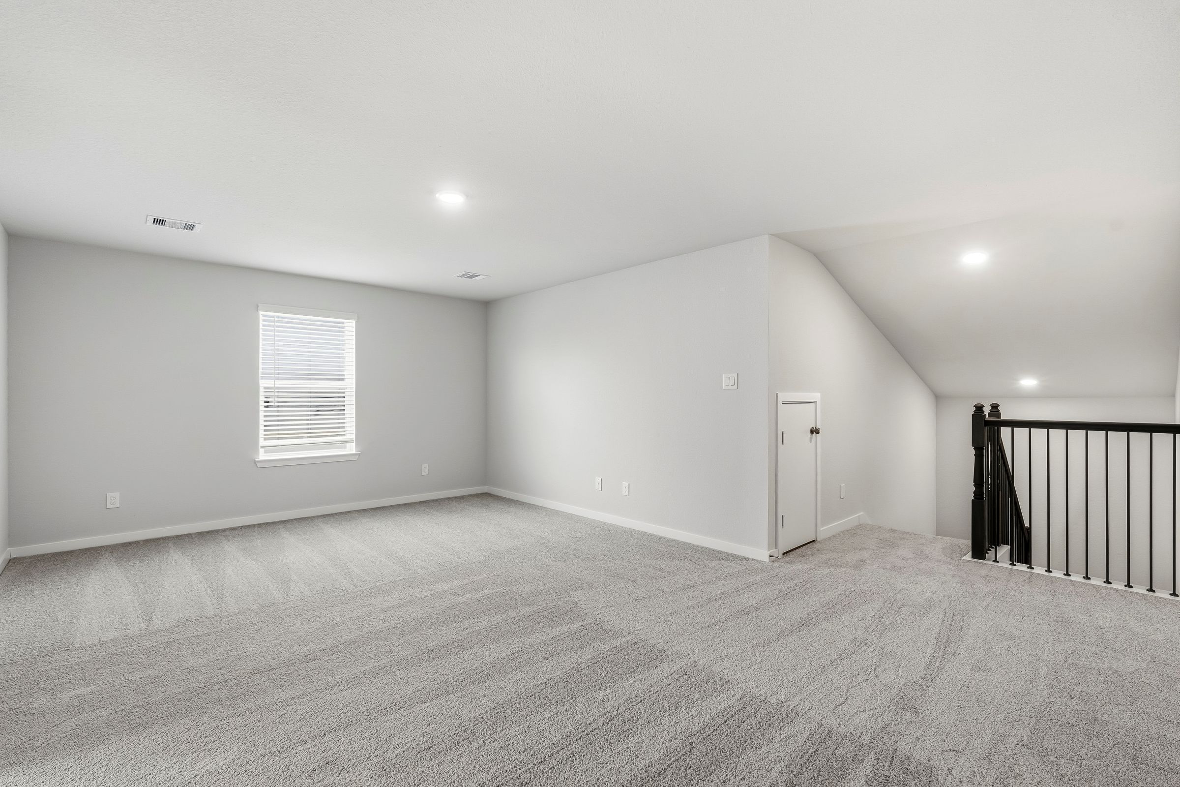 A room with a door and a window.