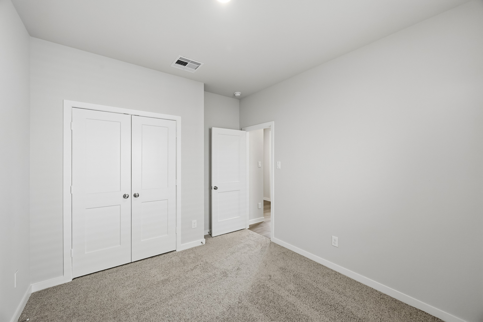 A room with white doors.