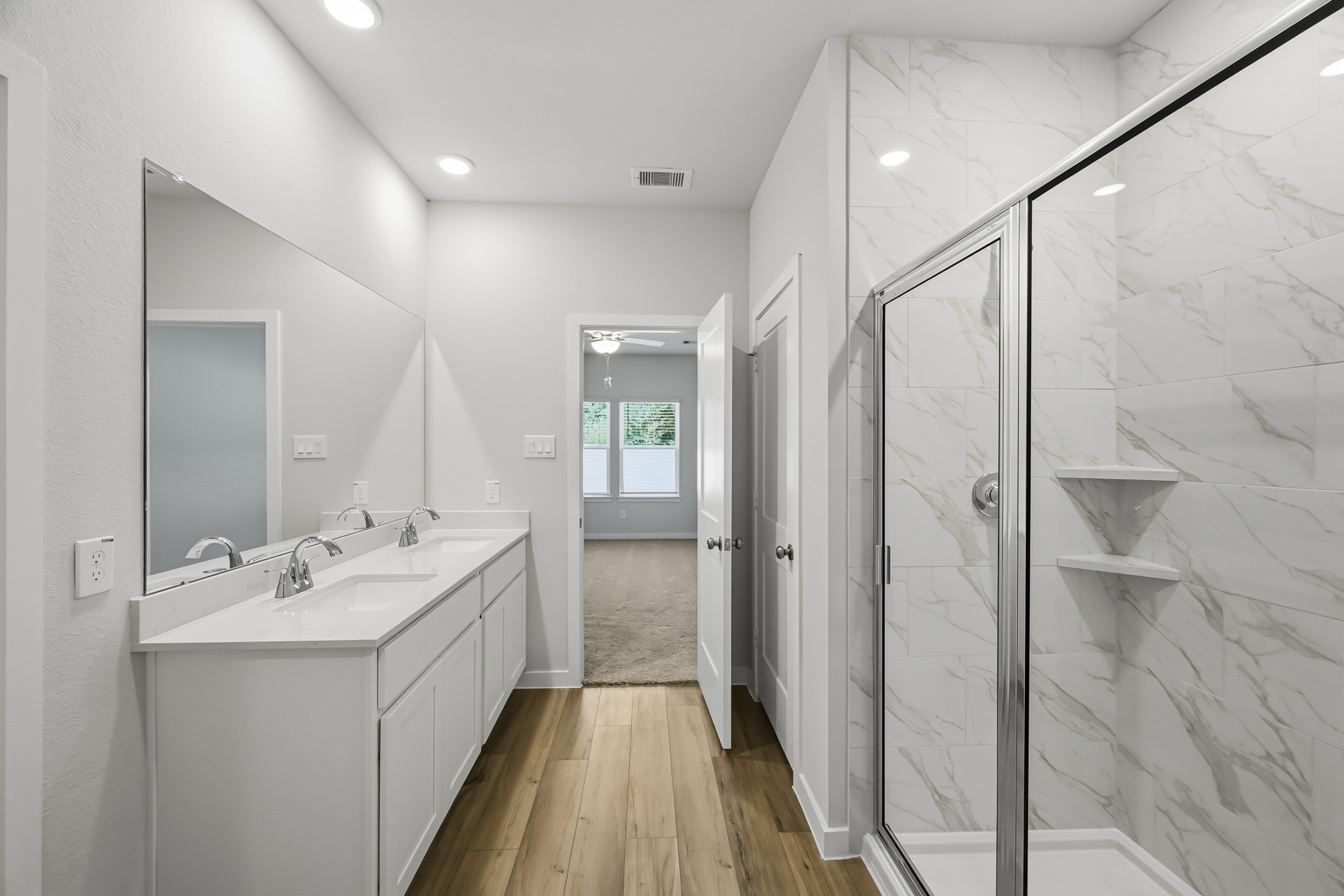 A bathroom with a glass shower.