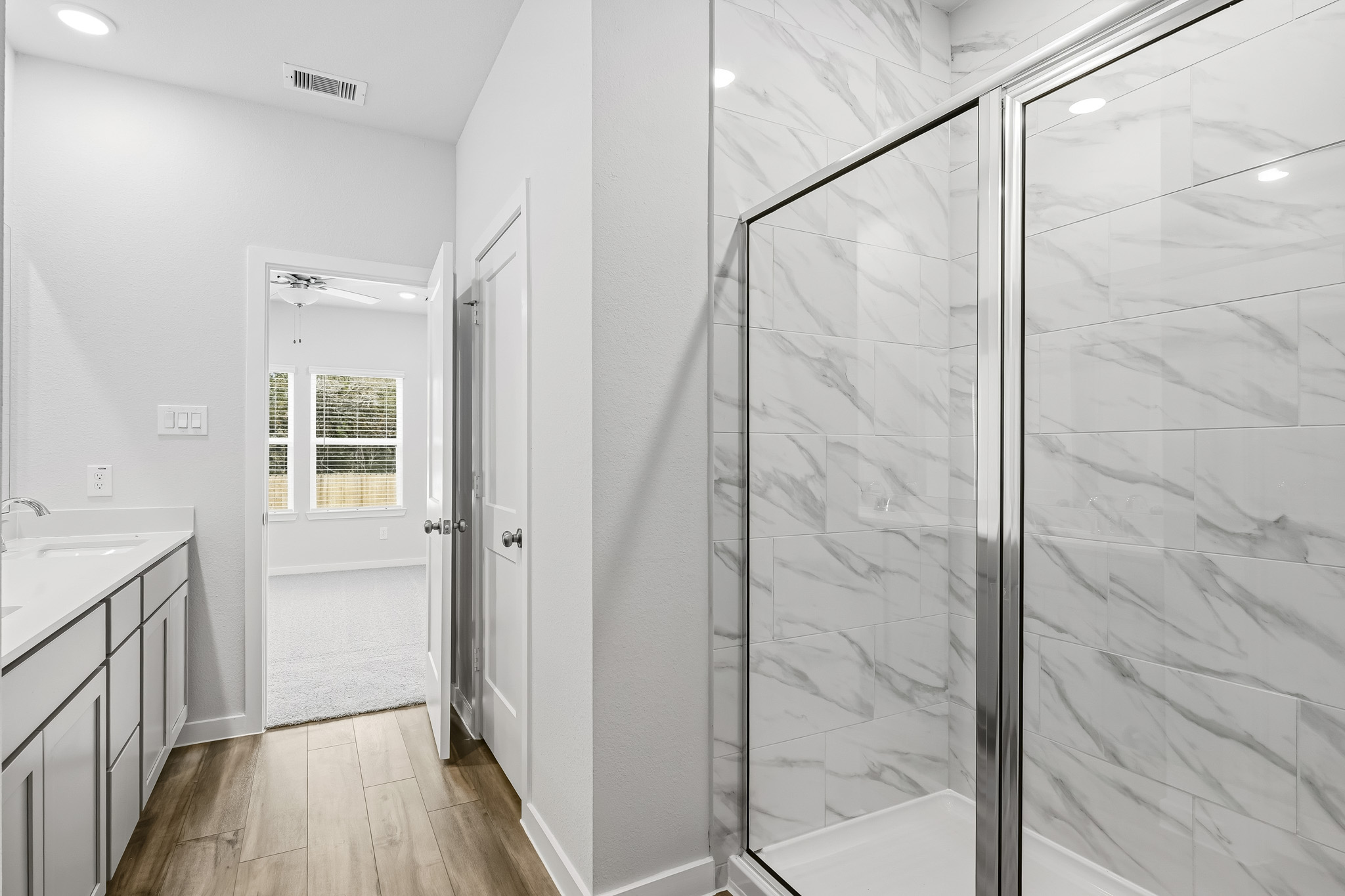 A bathroom with a glass shower.