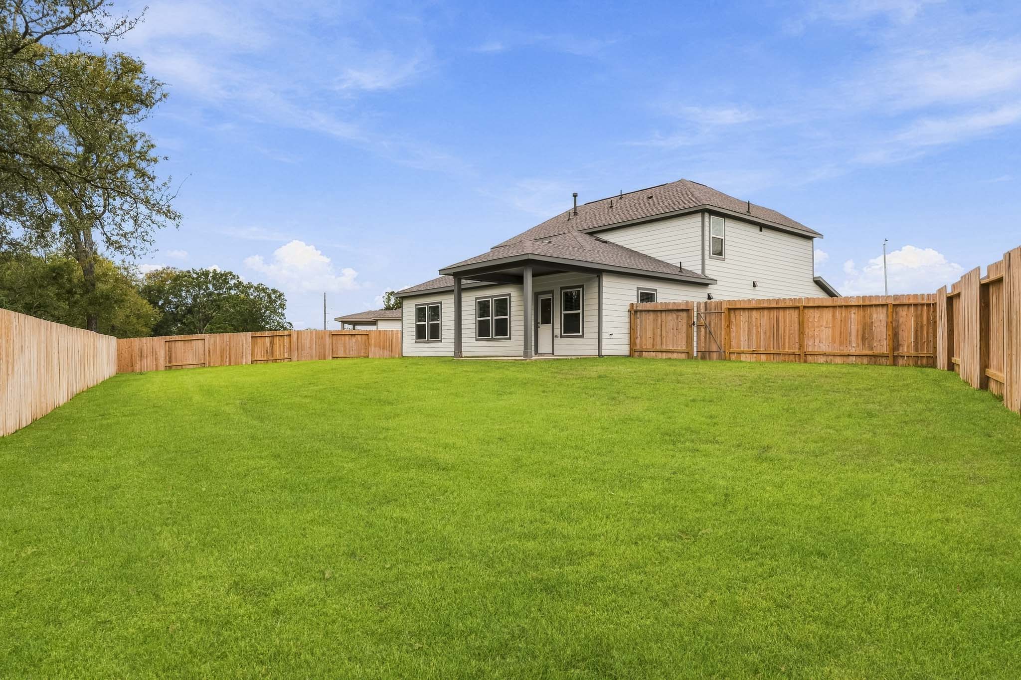 A house with a fence around it.